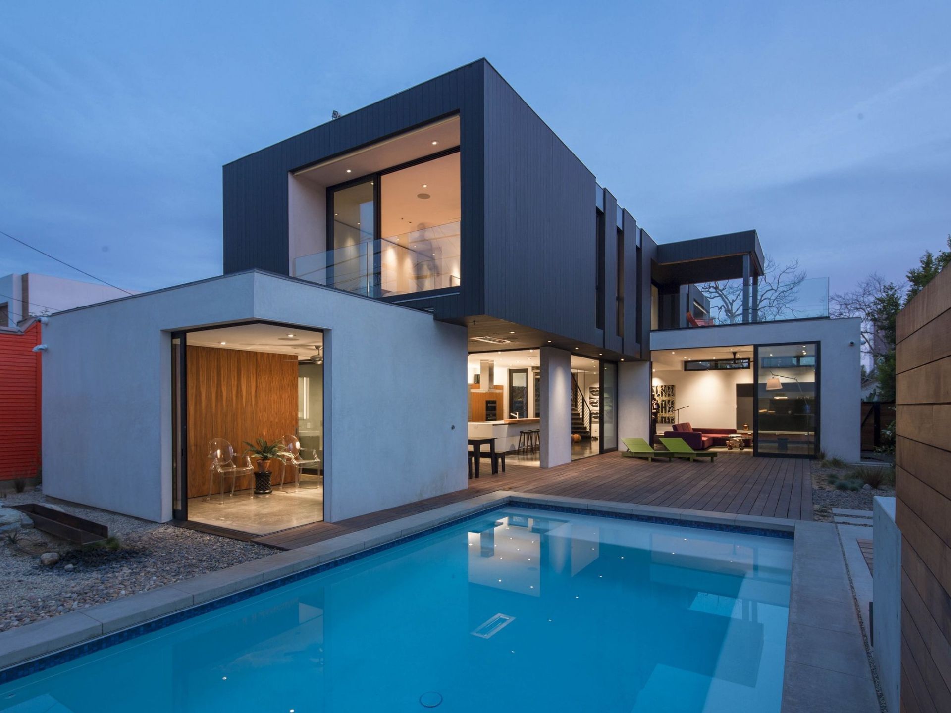 Two boxes house with a pool in backyard
