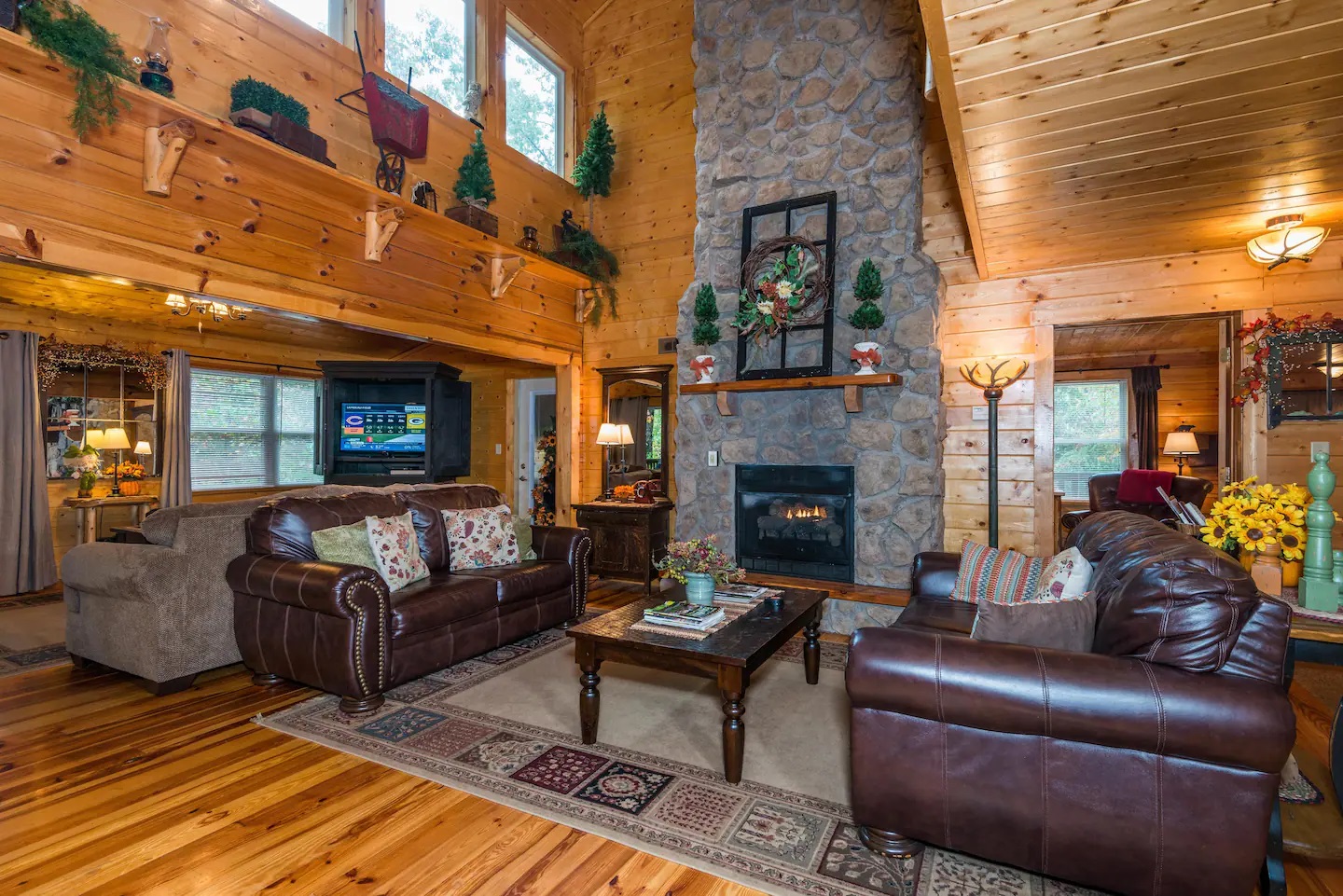 Fairytale Log Cabin living room with two couches and fireplace