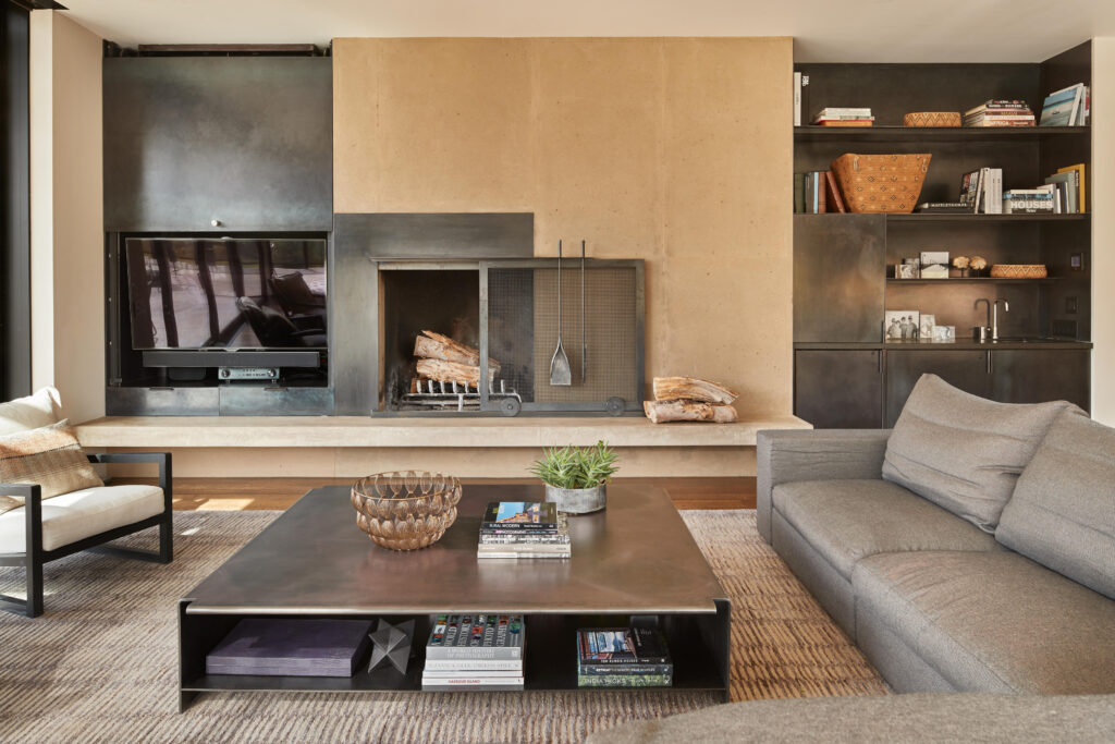 Minimalistic living room with tv, bookshelf's, coffee table