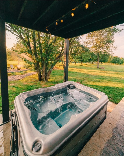 Grey hot tub outside during a sunny day