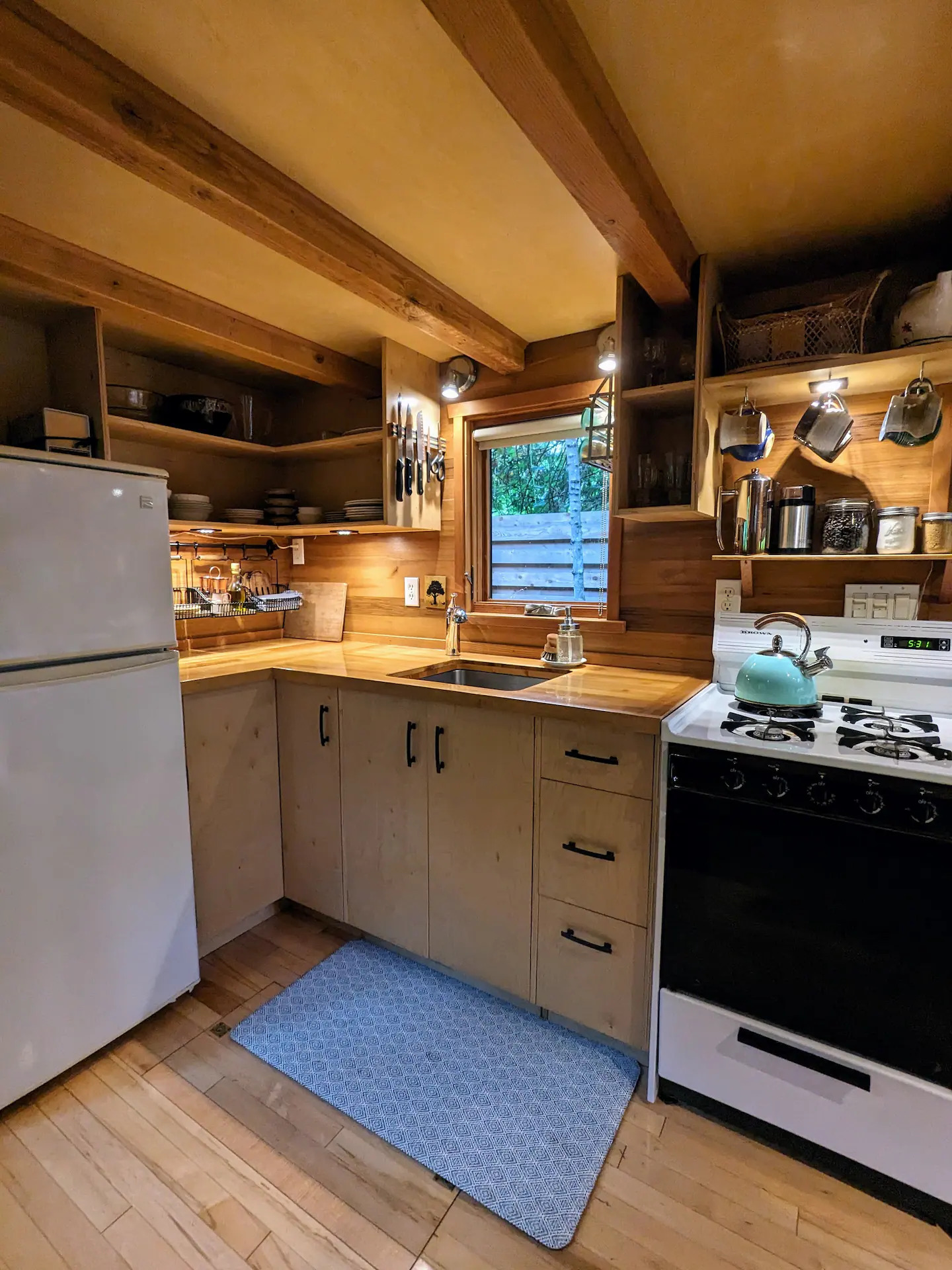 Kitchen, with a sink, fridge and oven