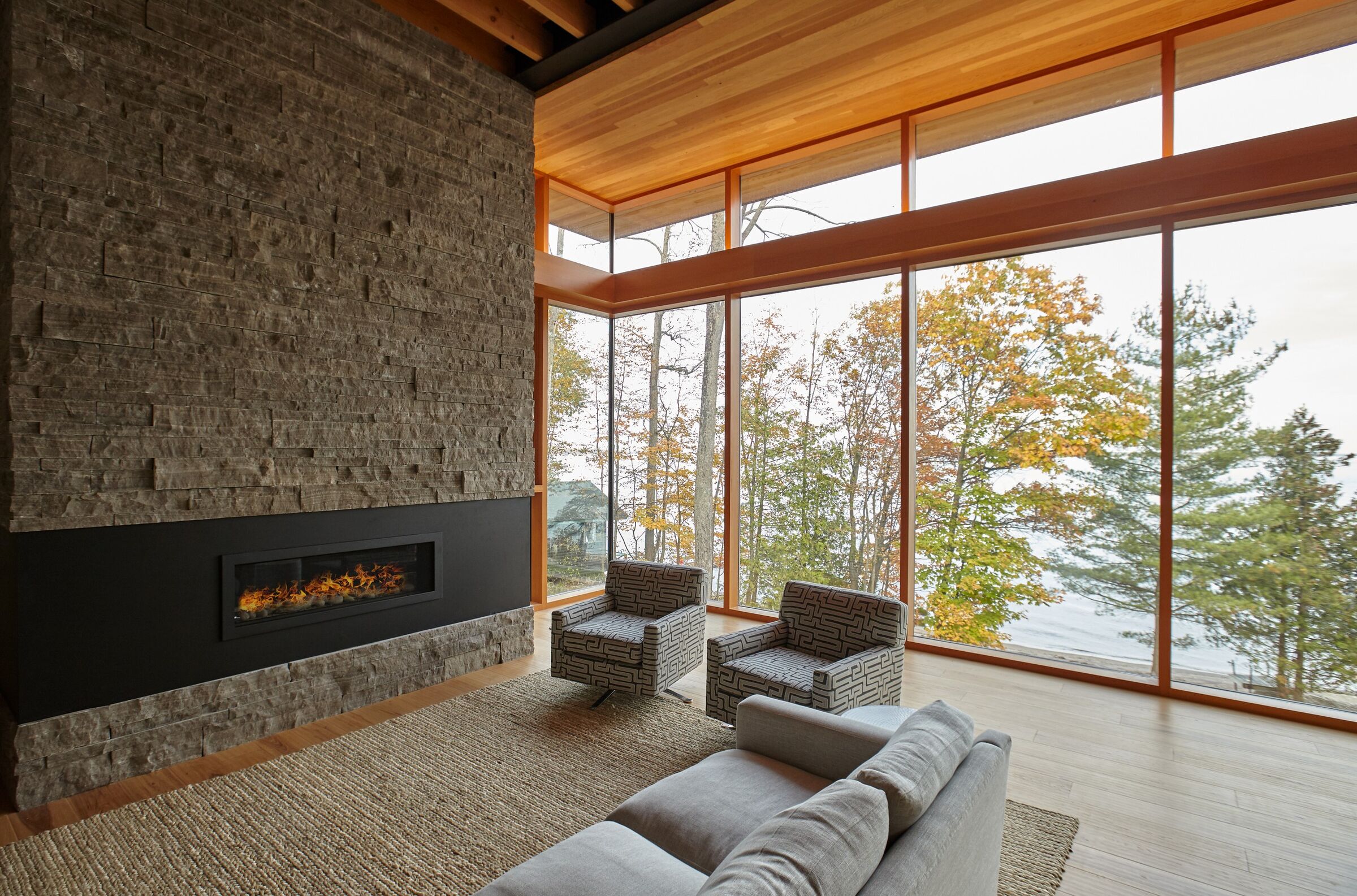 Living room with a lake view and marvelous fireplace