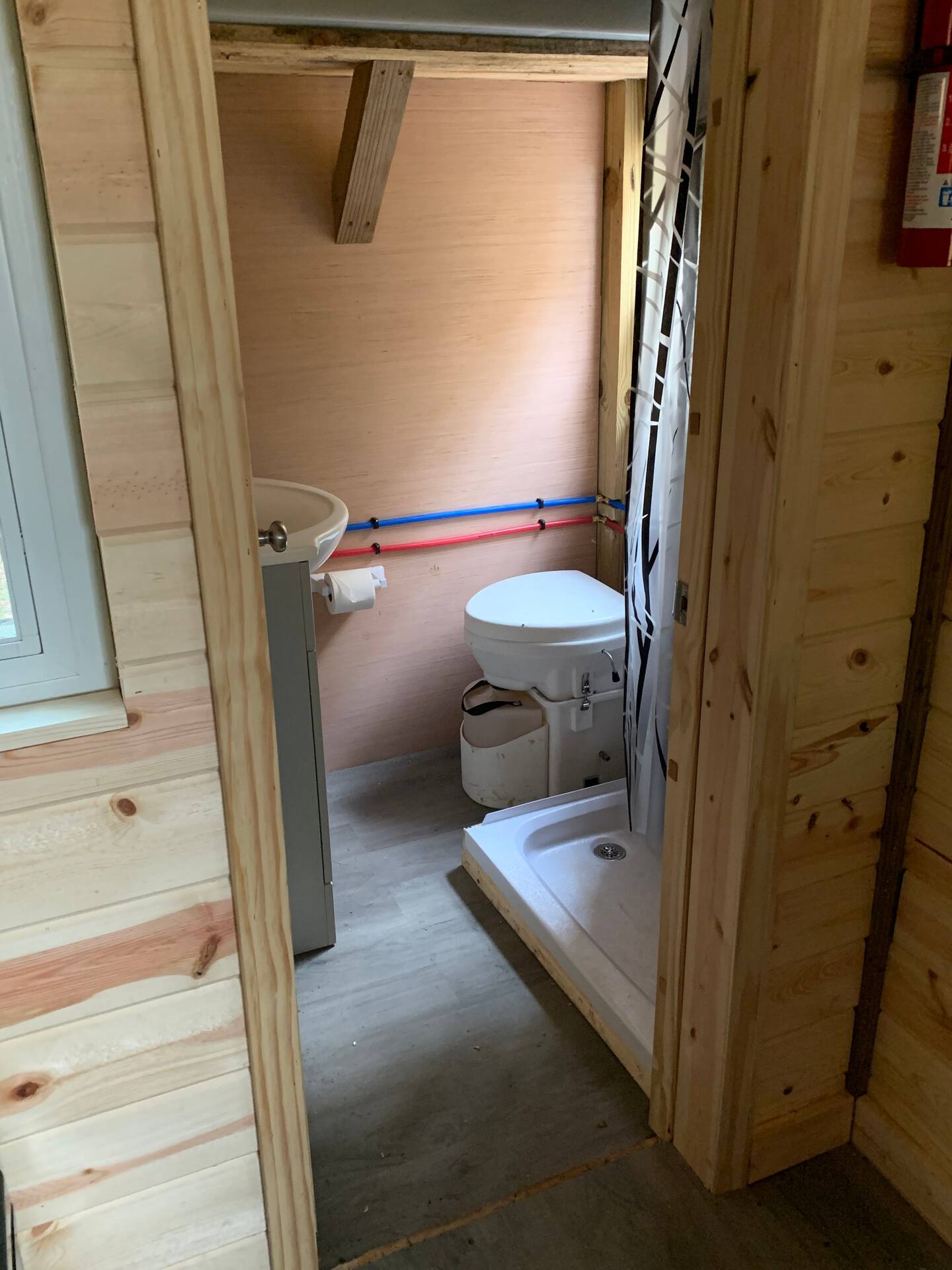Small toilette with a toilet and small shower