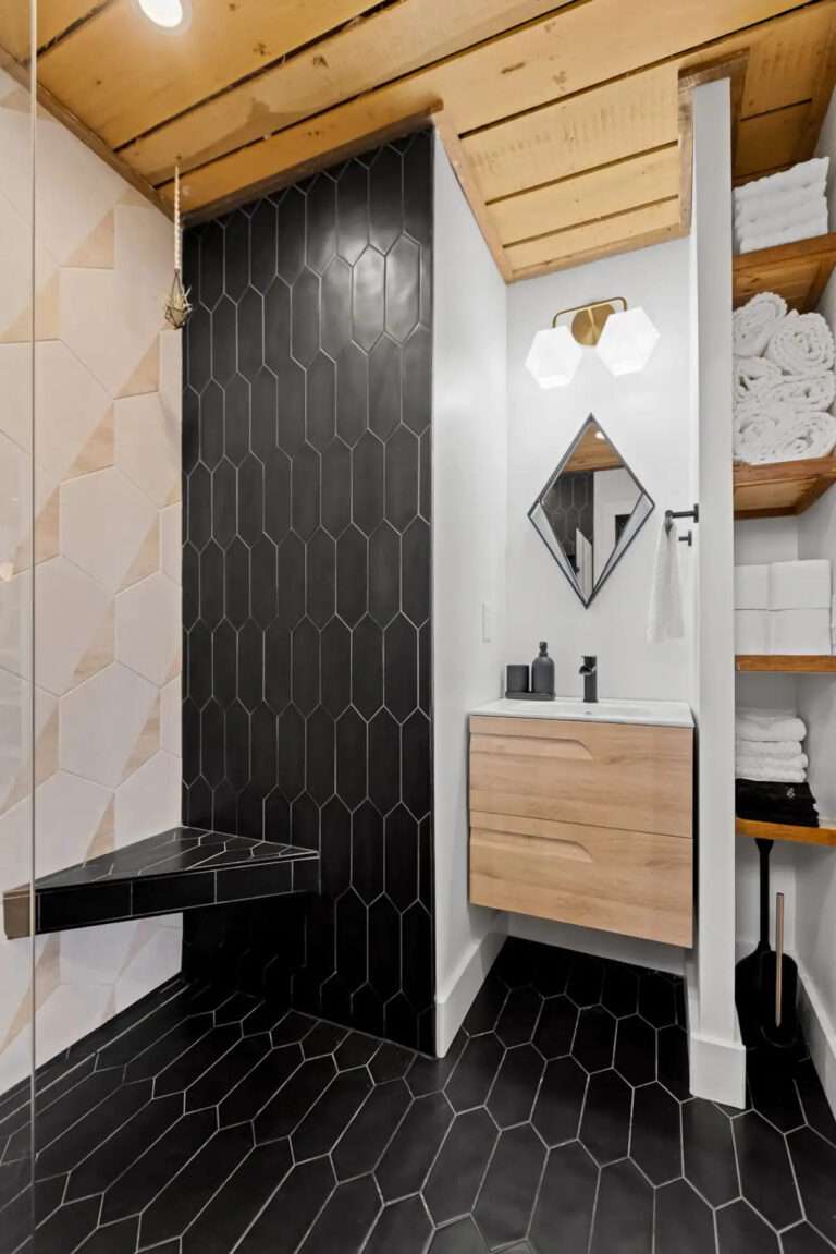 Black and unusual tiles in bathroom