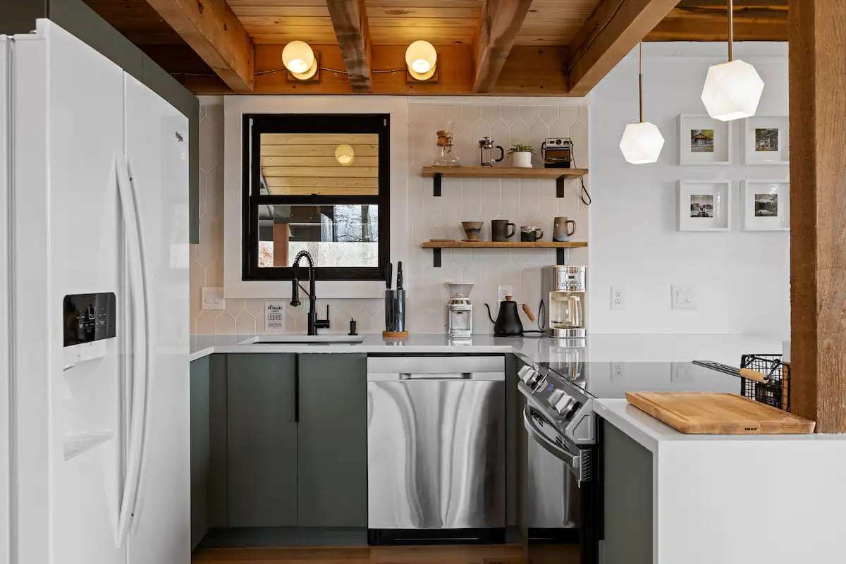 Gray-green kitchen with white fridge