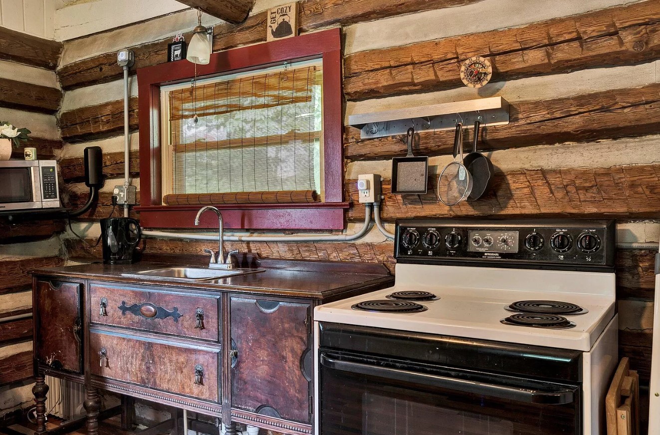 detailed look on the brown countertop with a sink and other kitchen utilities