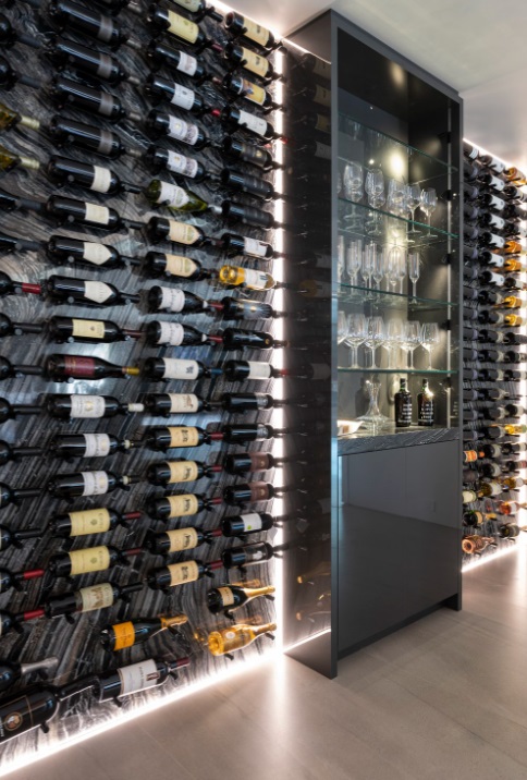 a display of wine bottles and wine glasses