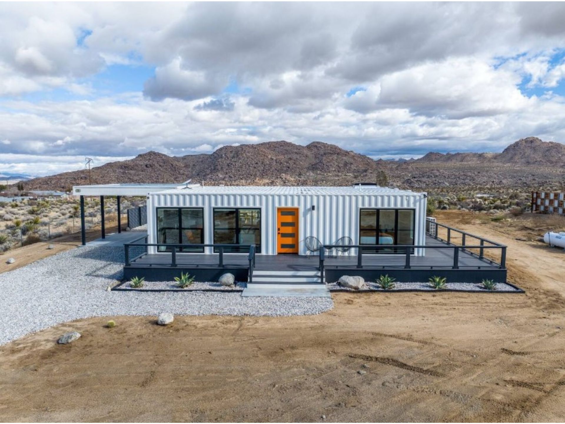 exterior of a shipping container house in the desert