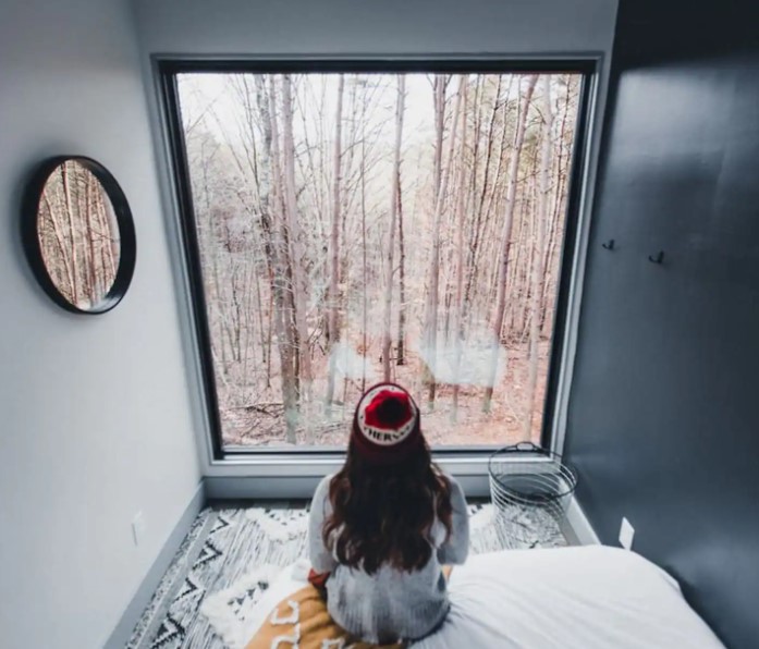bedroom with a nice view of the woods