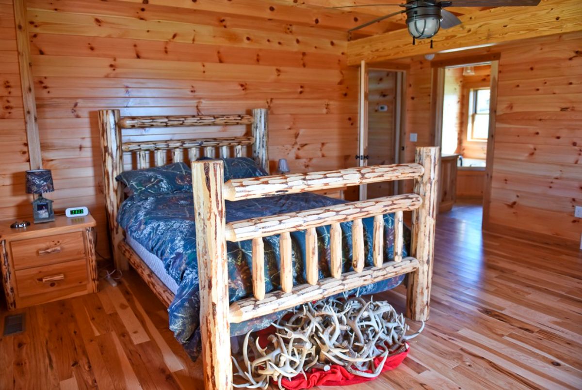 bedroom with a bed with a wooden bed frame