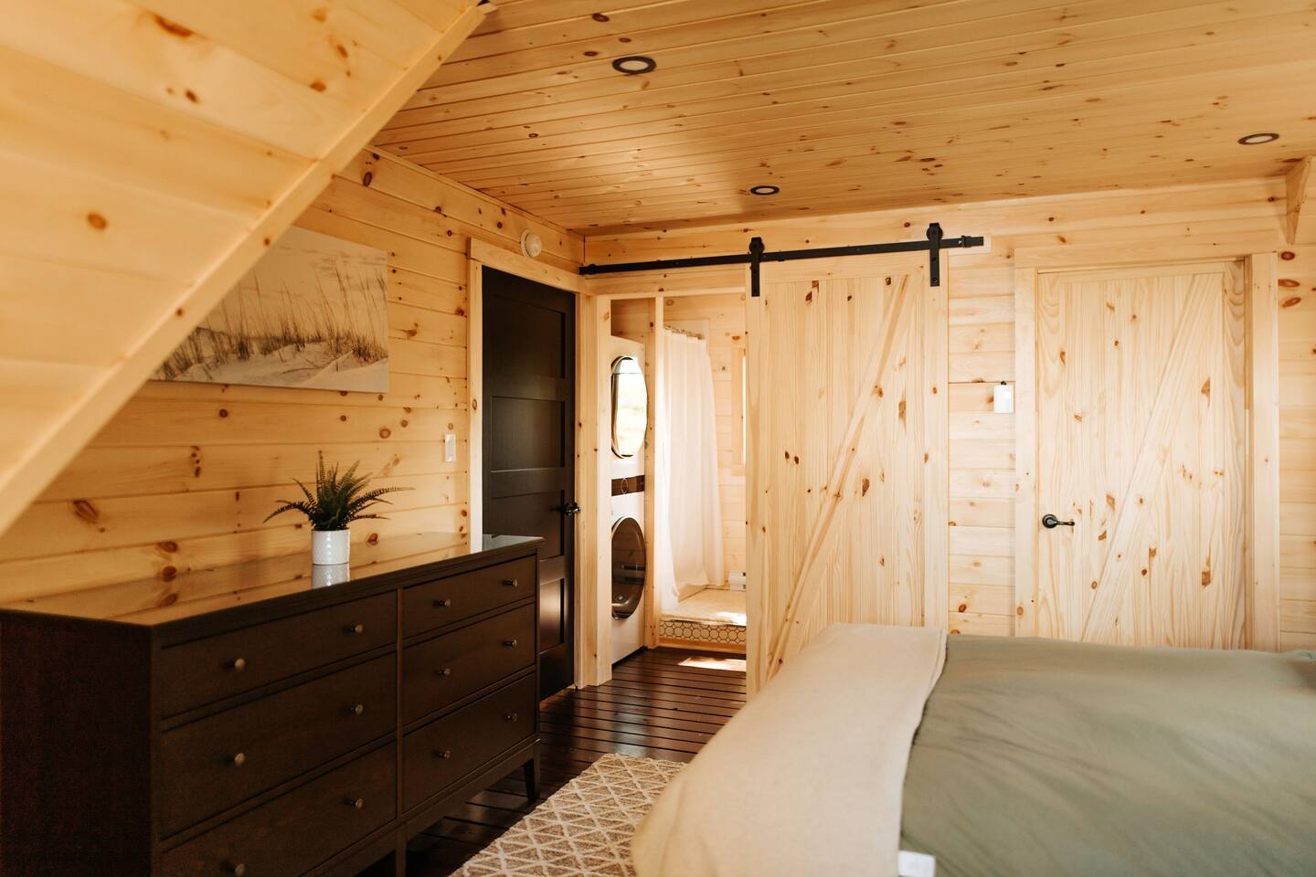 black cabinet in a bedroom of a cabin
