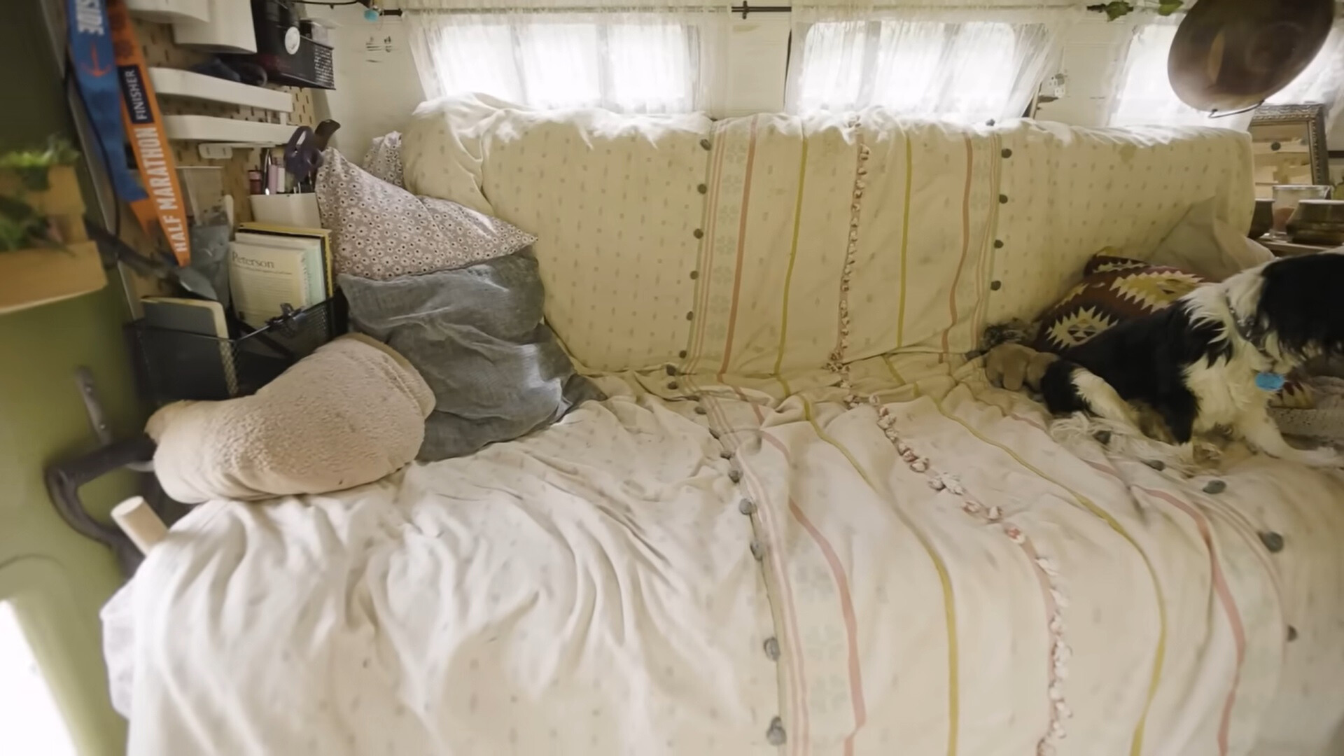 comfy couch and bed in a tiny house