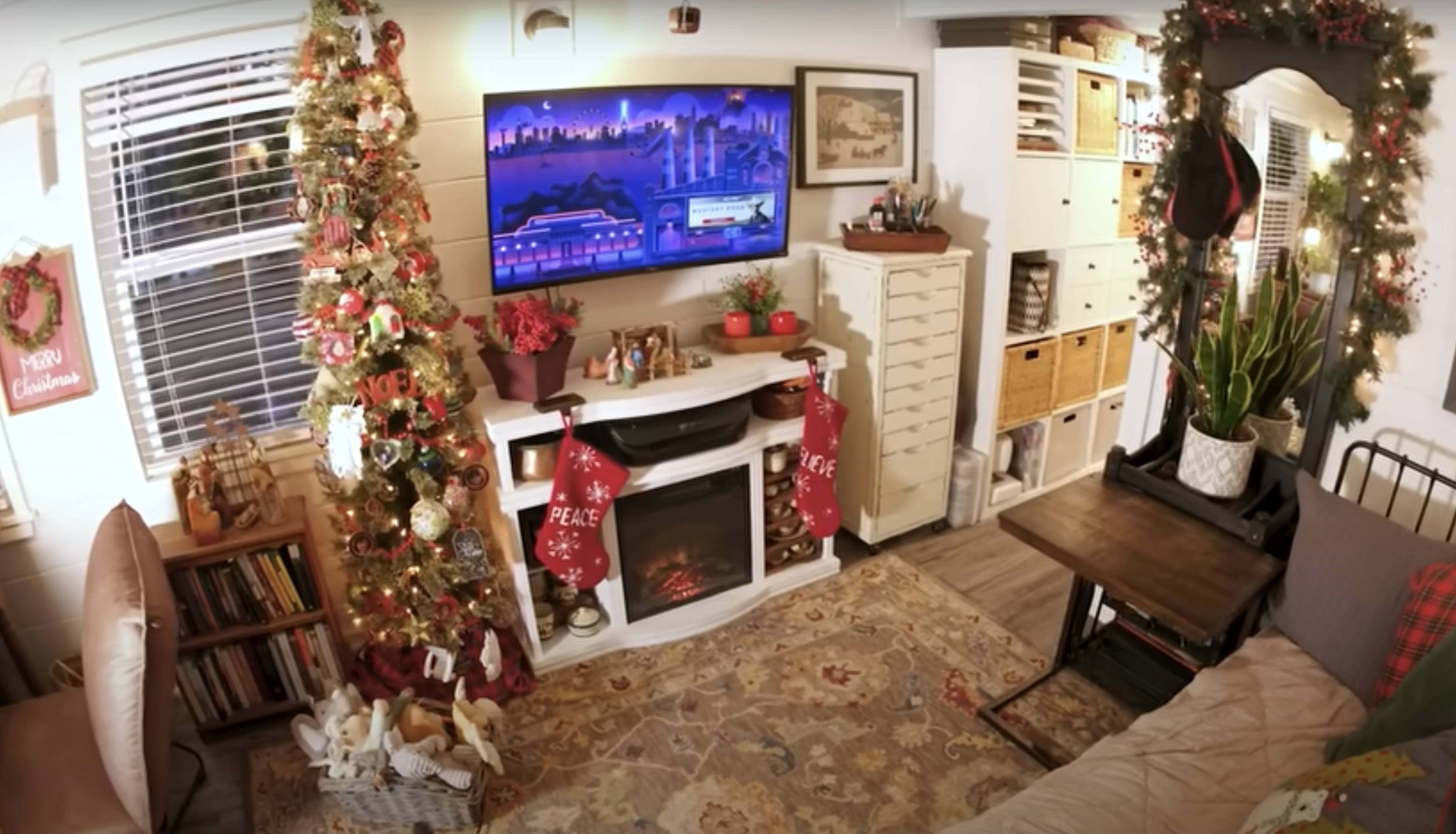 decorated tiny house with fireplace and tv