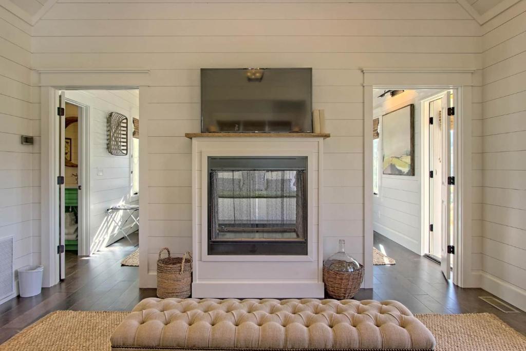 flat screen tv and white walls of a living room