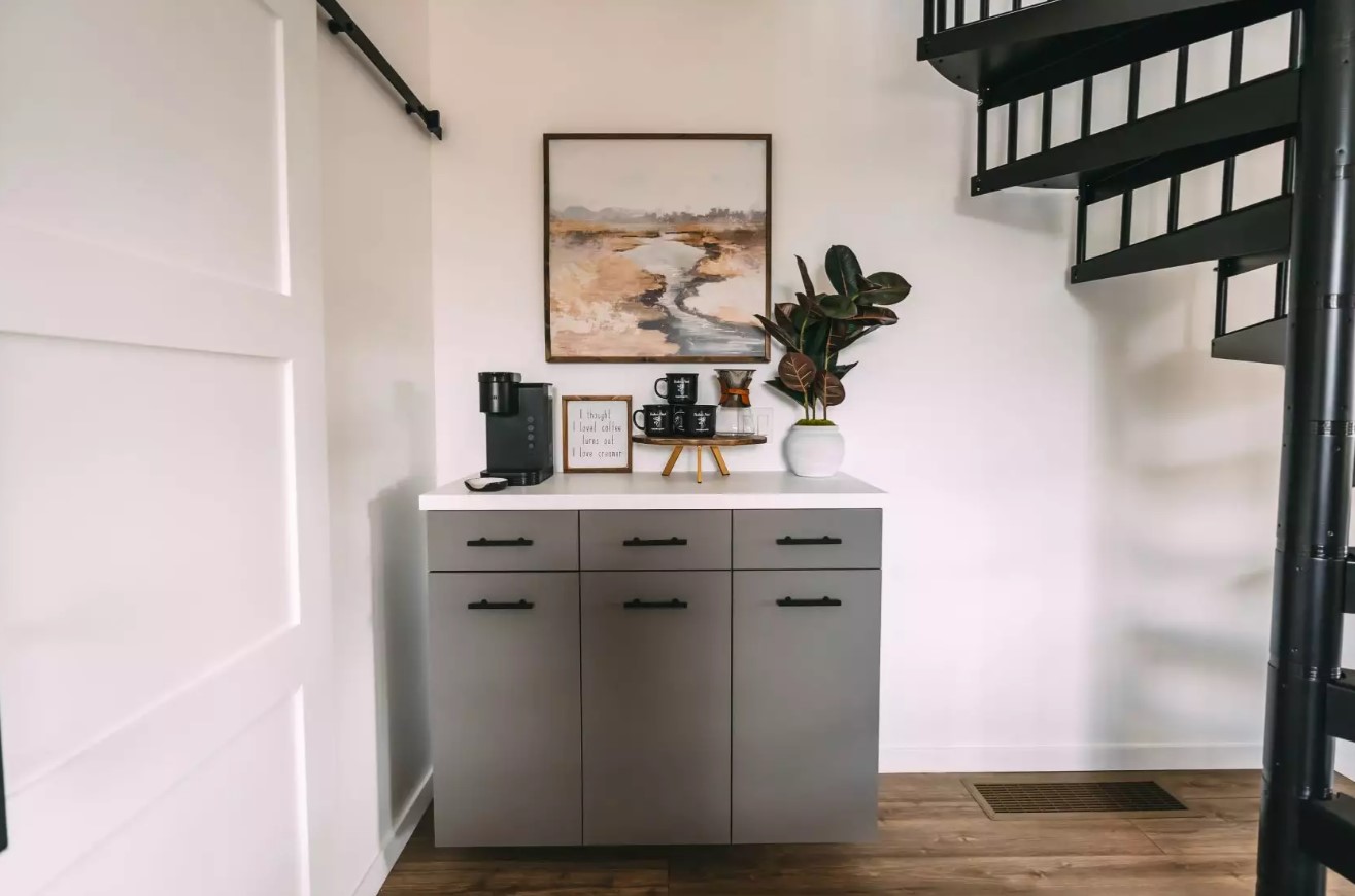 gray cabinet with a coffee machine on top
