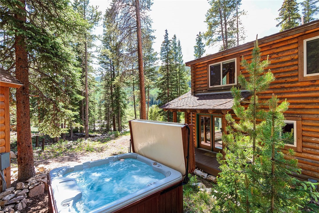 hot tub next to a cabin