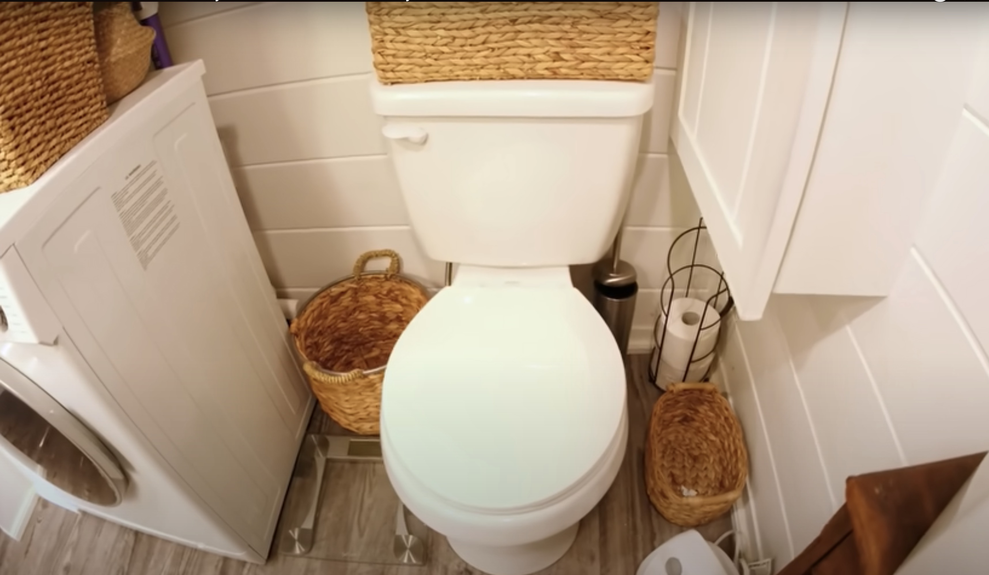 tiny house with white toilet and washing machine