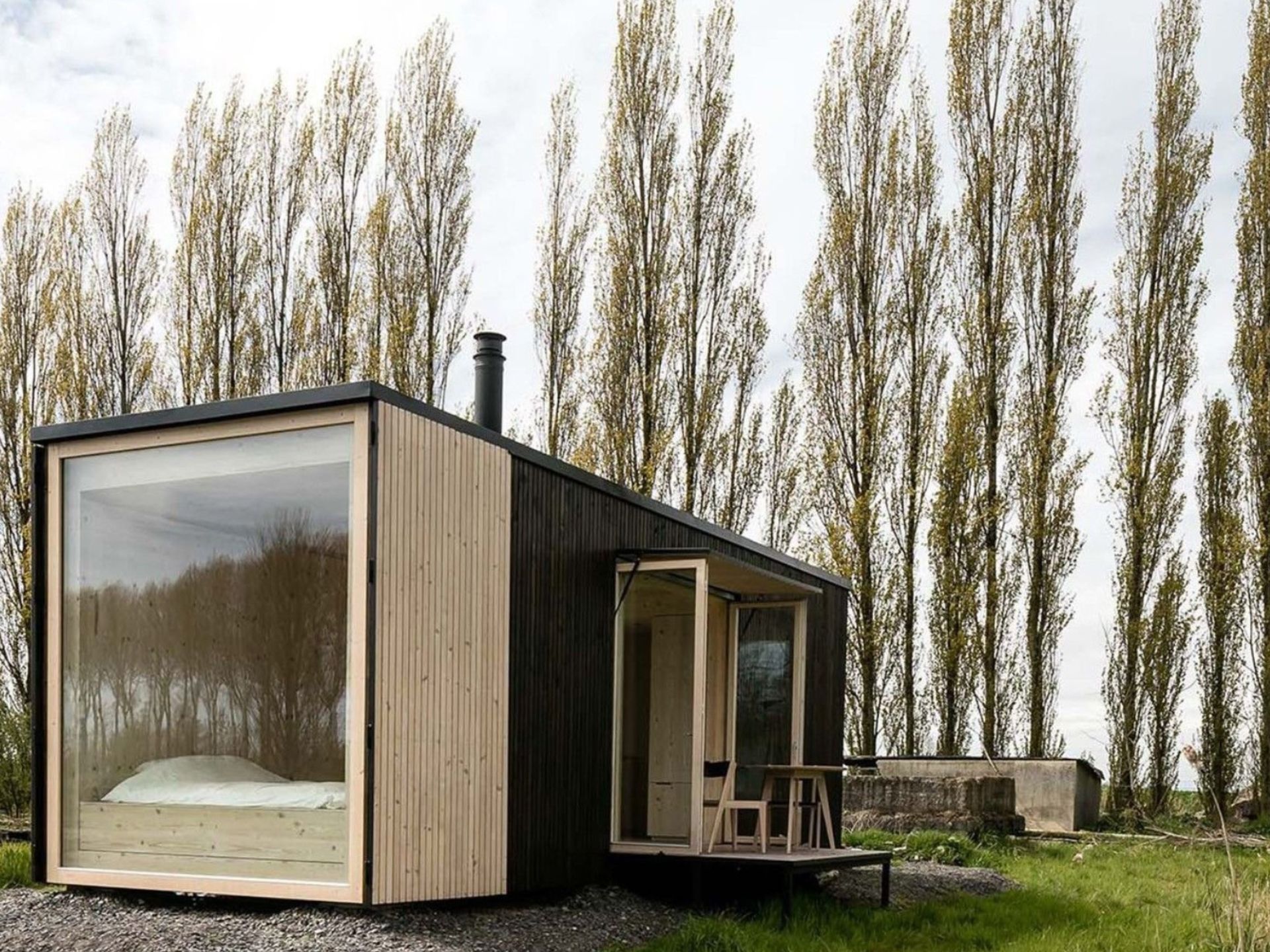 A Minimalistic Container Home That Feels Like You Are Living Inside Of A Tree