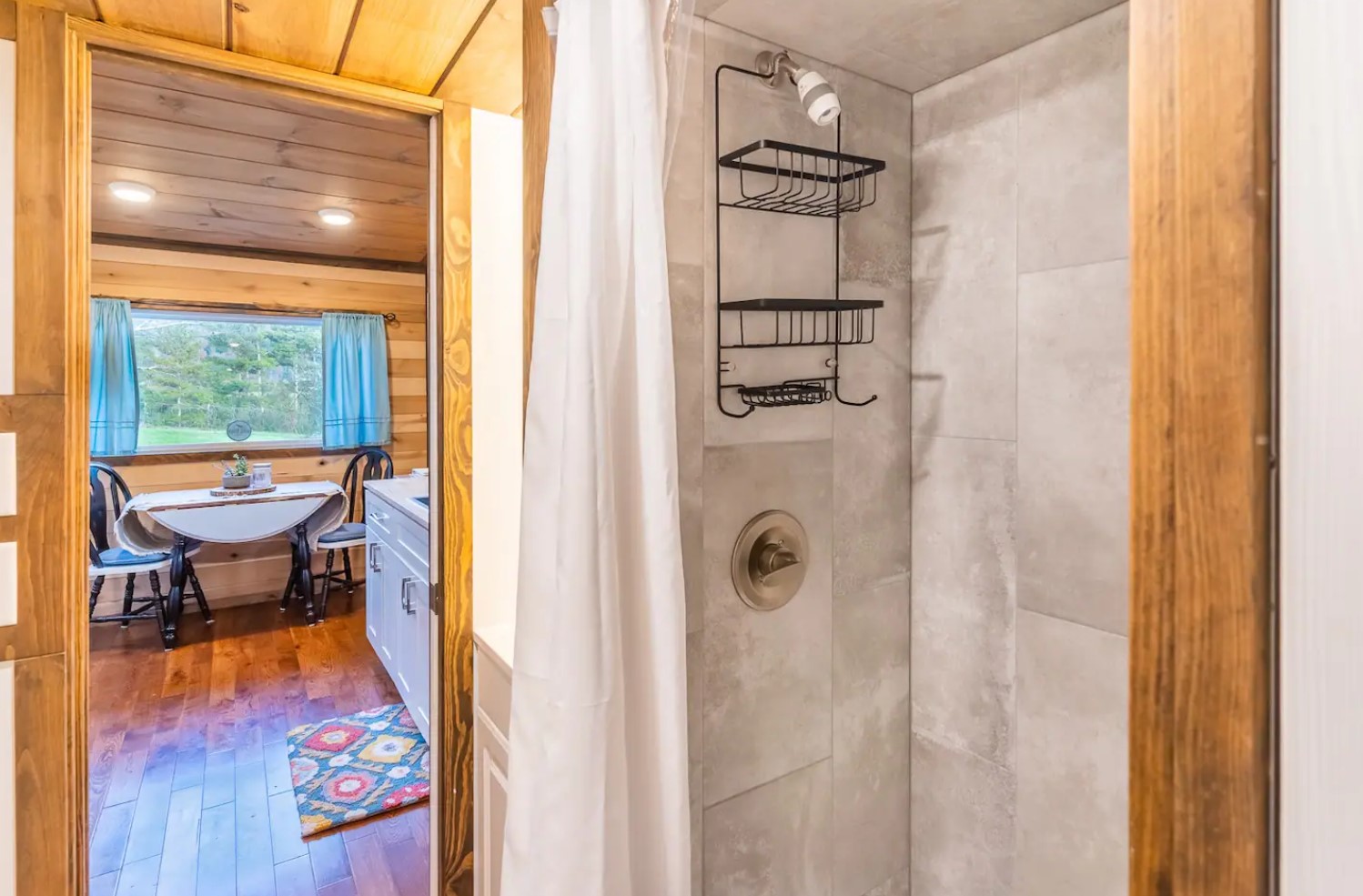 Bathroom with full size shower and marble tiles