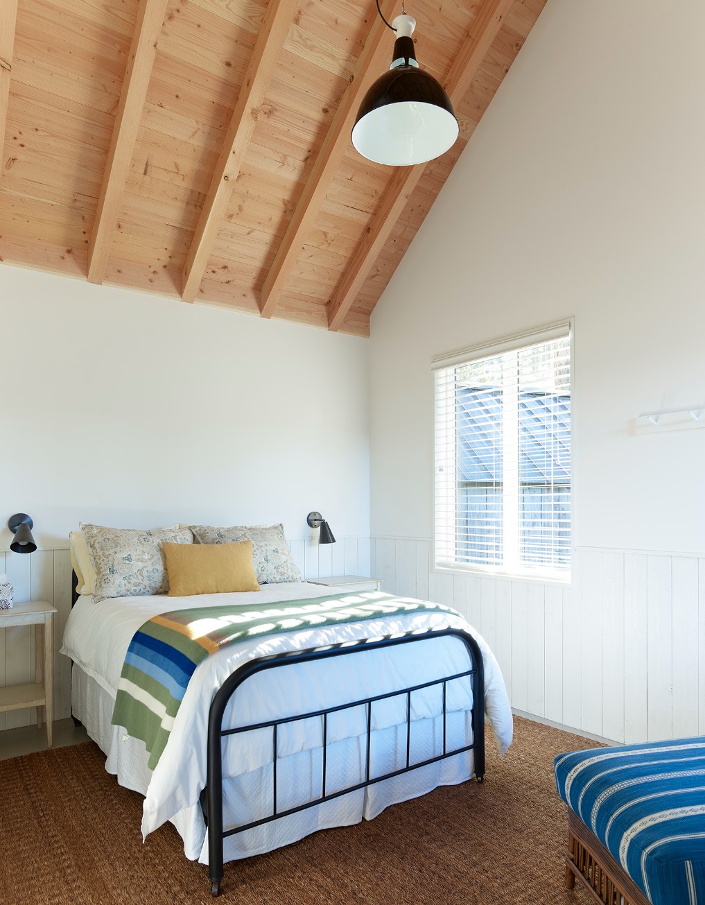 Bedroom with a bed, window black light fixtures