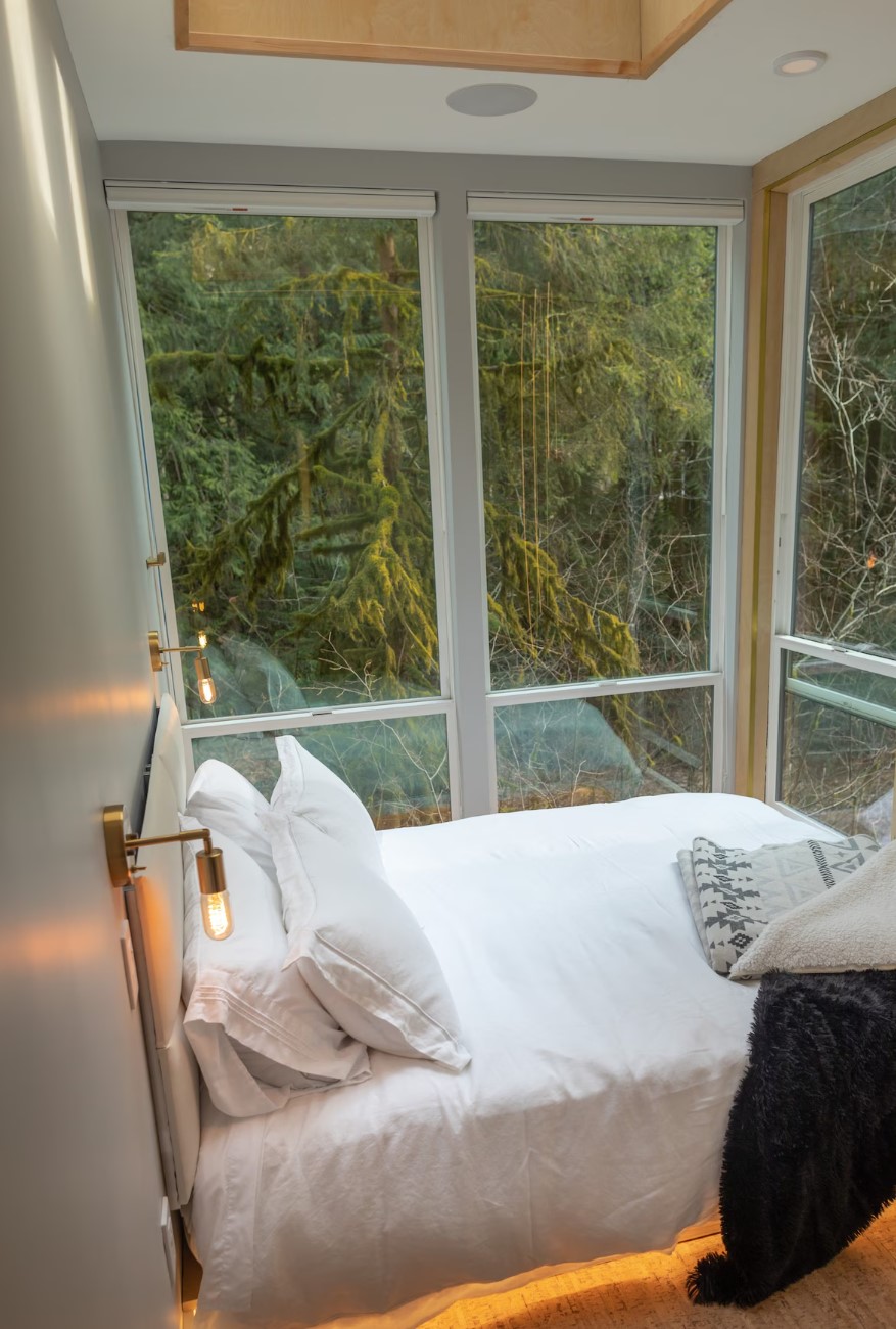 Bedroom with large windows and LED lights