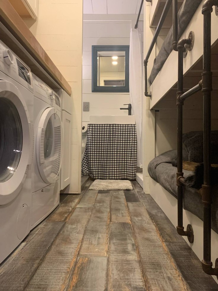 Rustic style bunk beds with washer and dryer across