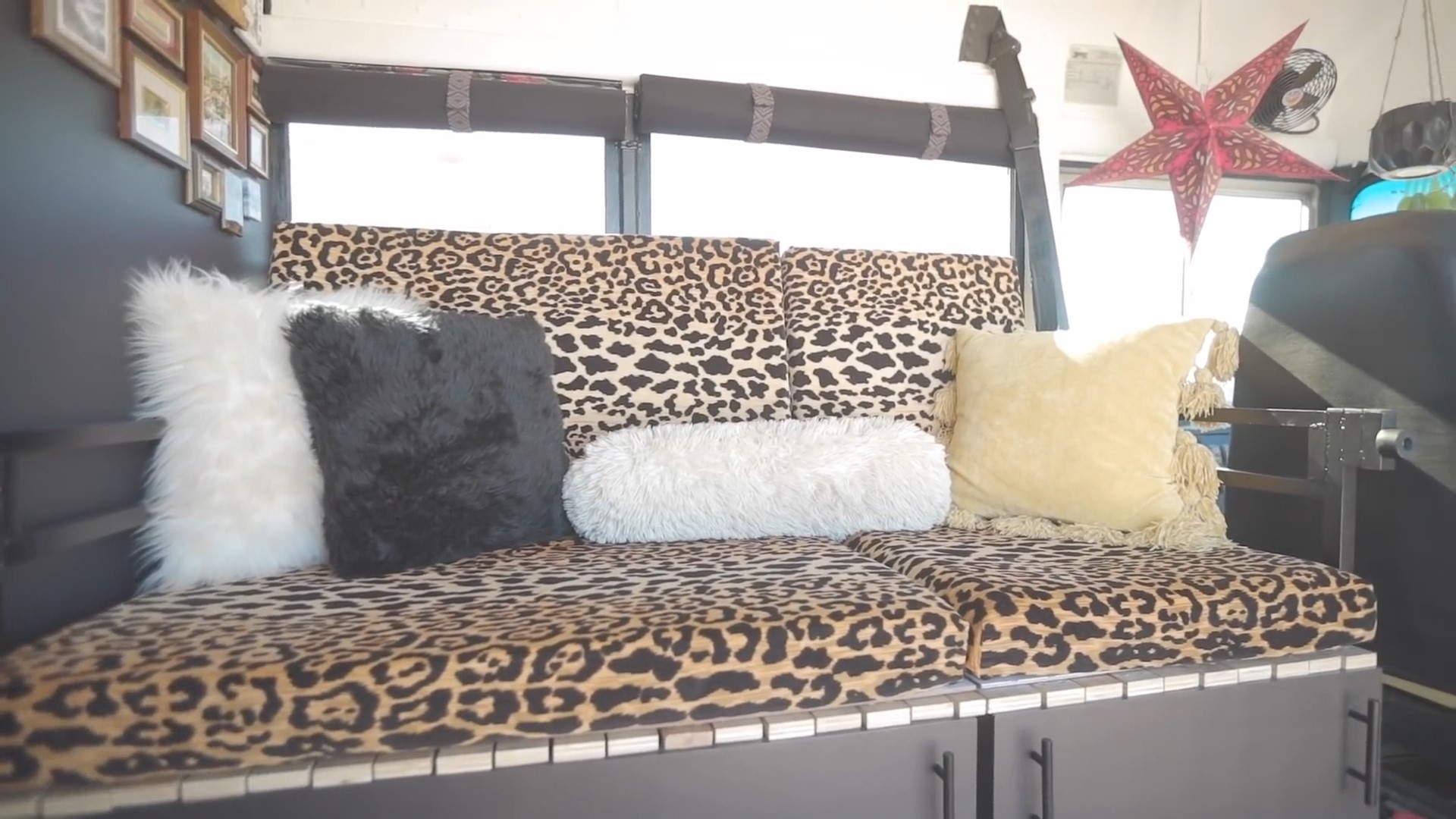 Leopard print couch in a house bus