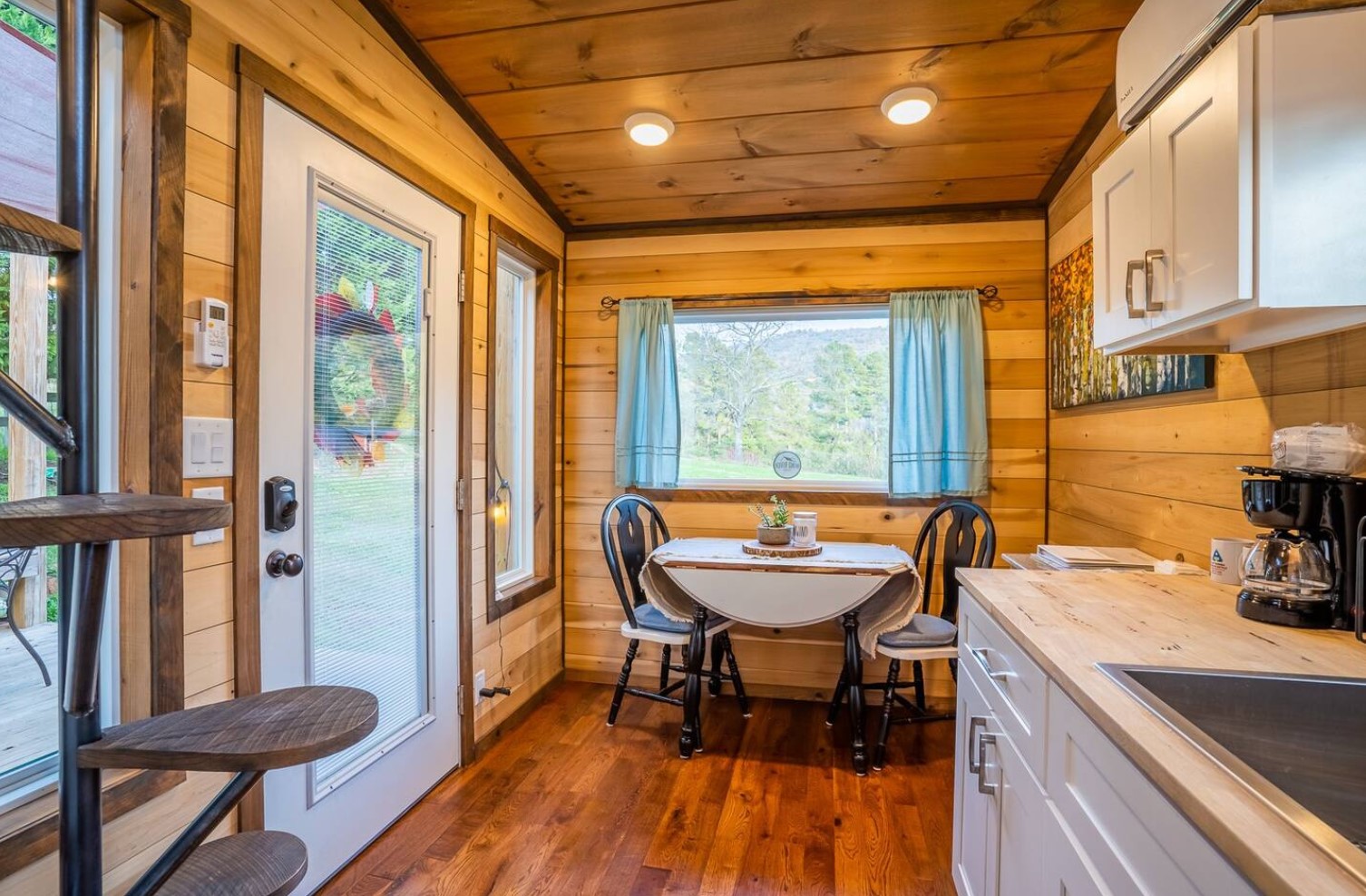 Dining room area with small table and windows