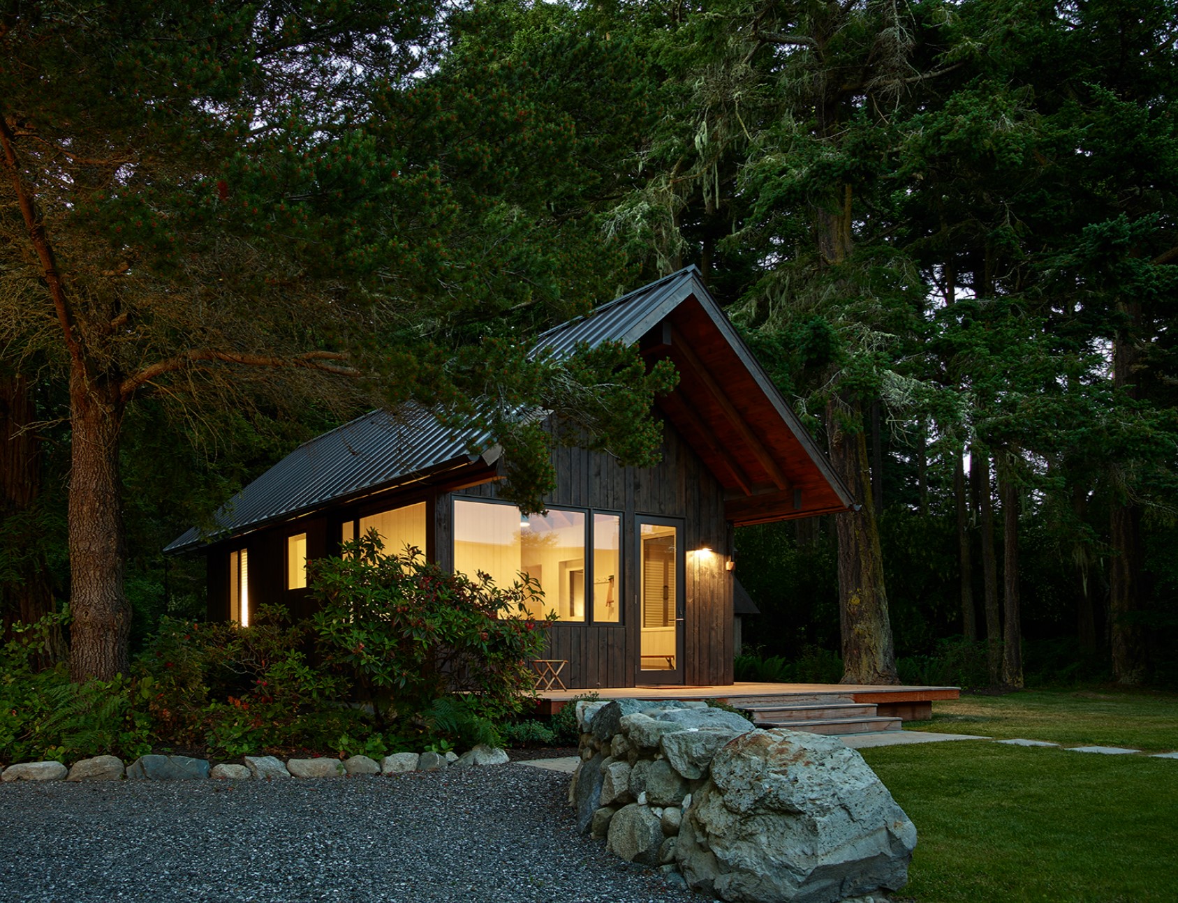 Exterior of a cabin with a rock pathway