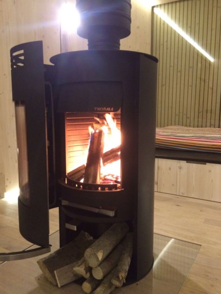 Small fireplace inside of a container home