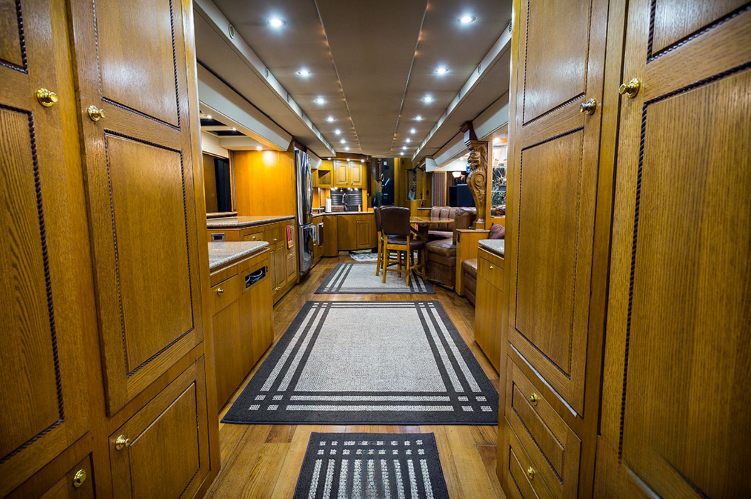 Interior of motorhome with a wooden details and black and white carpets