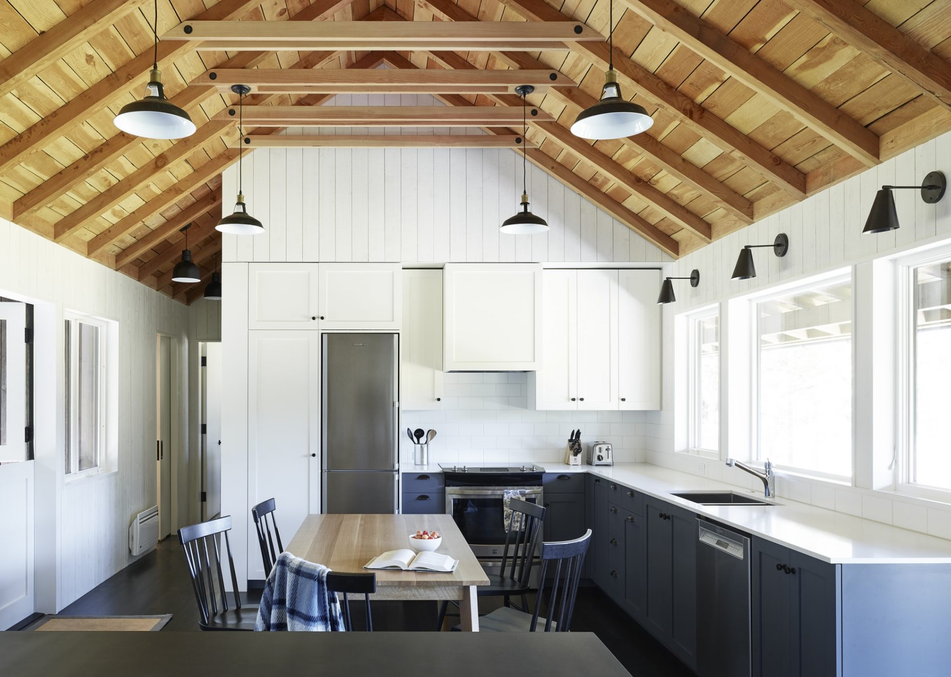 Kitchen with a dining table and gray cabinets