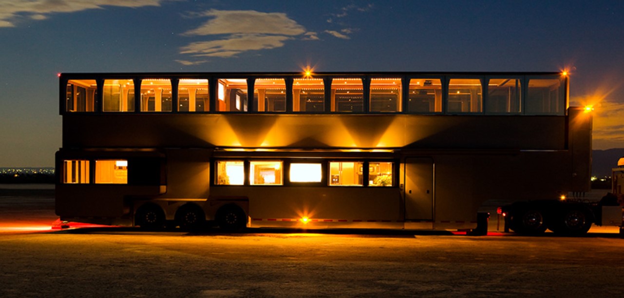 Exterior of two floor motorhome that completely lights up