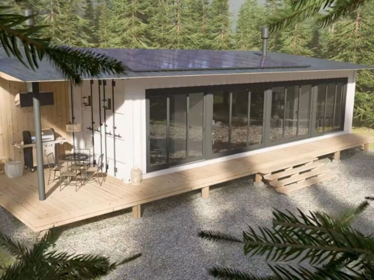 exterior of the three bedroom container home with a nice deck all around it