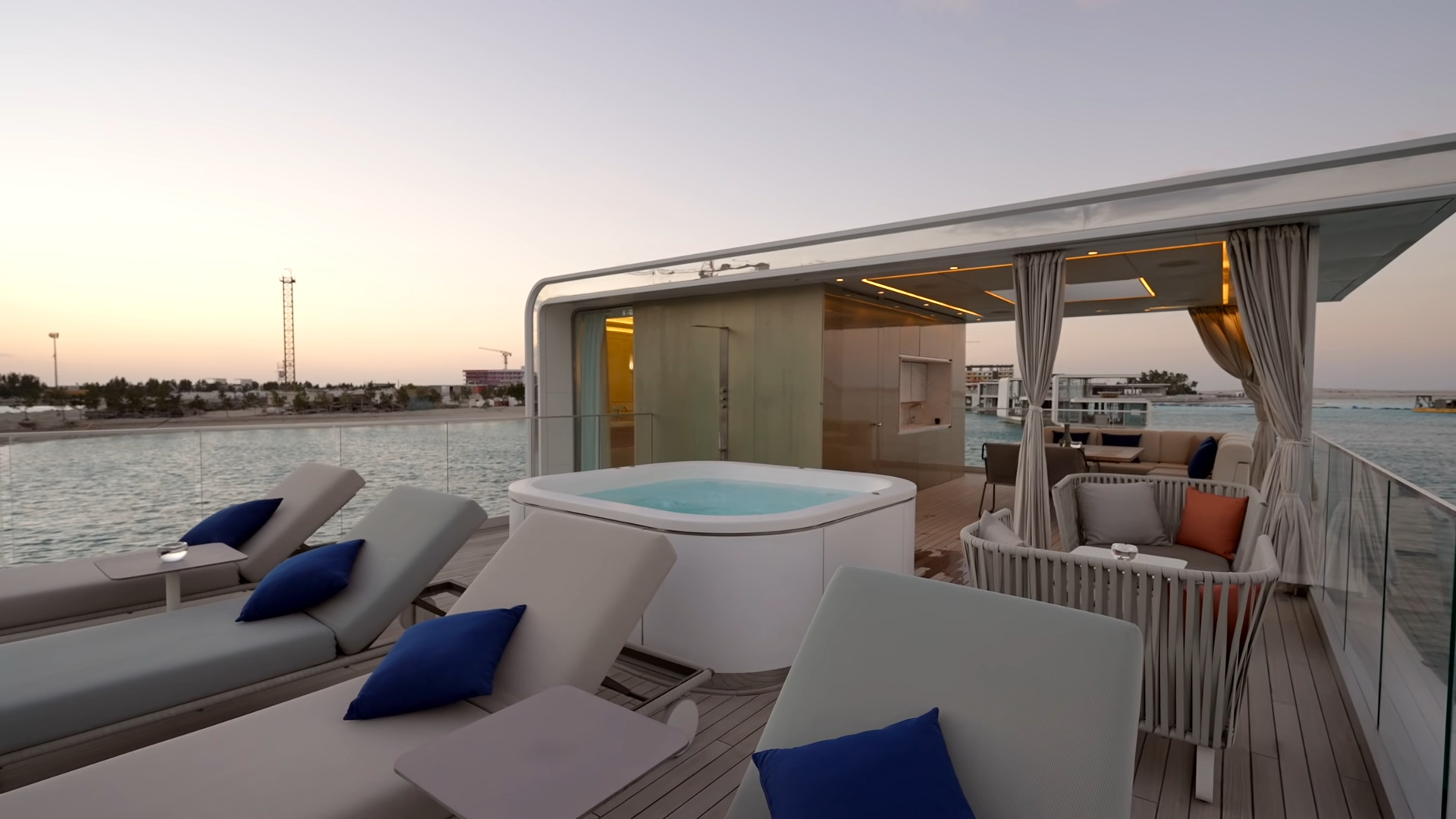 Lounge area on the roof of a home with a jacuzzi