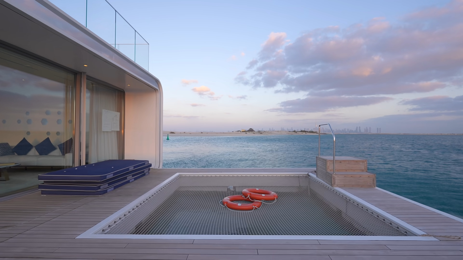 Patio on a floating home with a pool