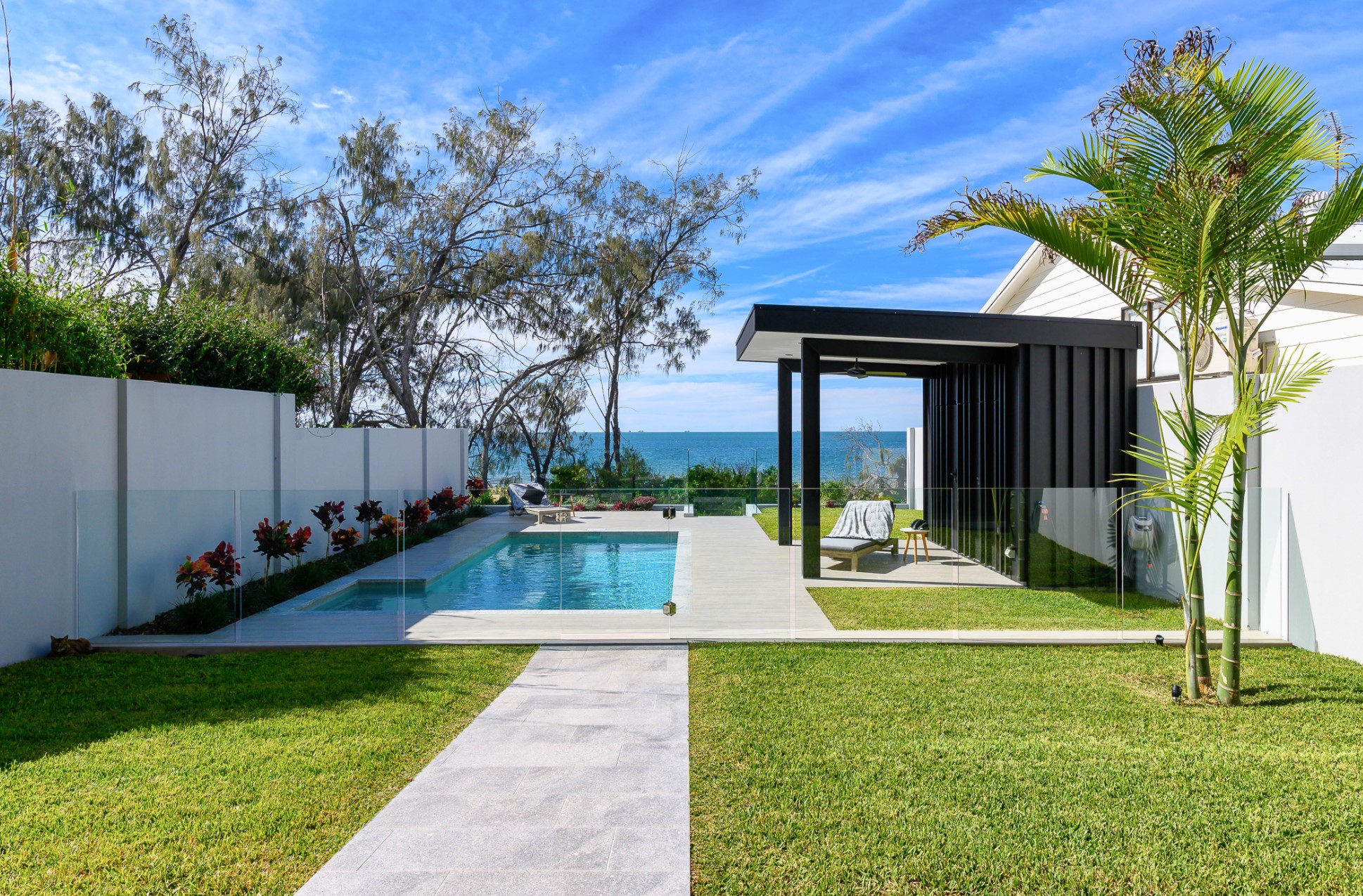 pool in backyard with a view on the see