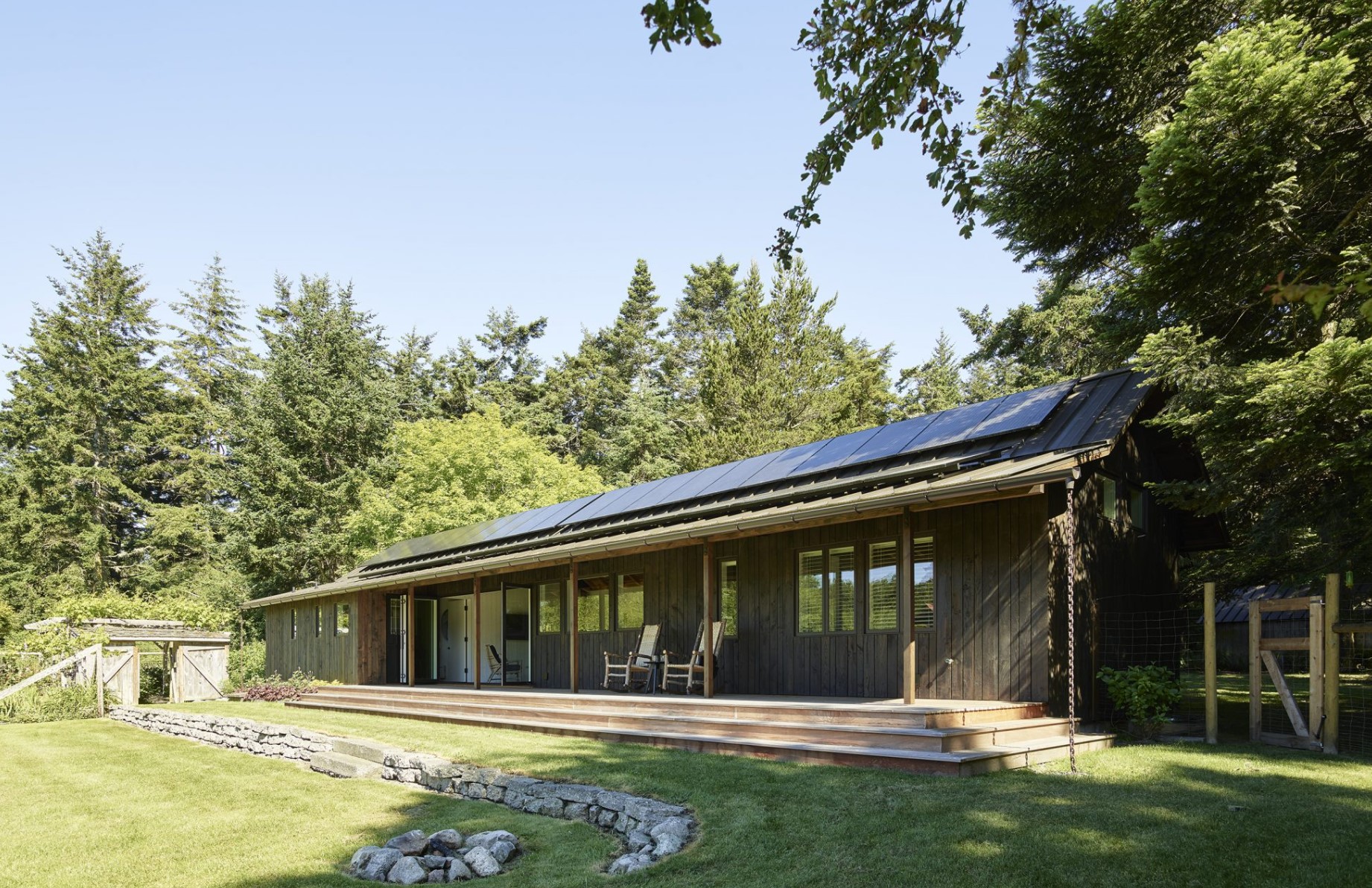 Side profile of a cabin with chairs and a fire place