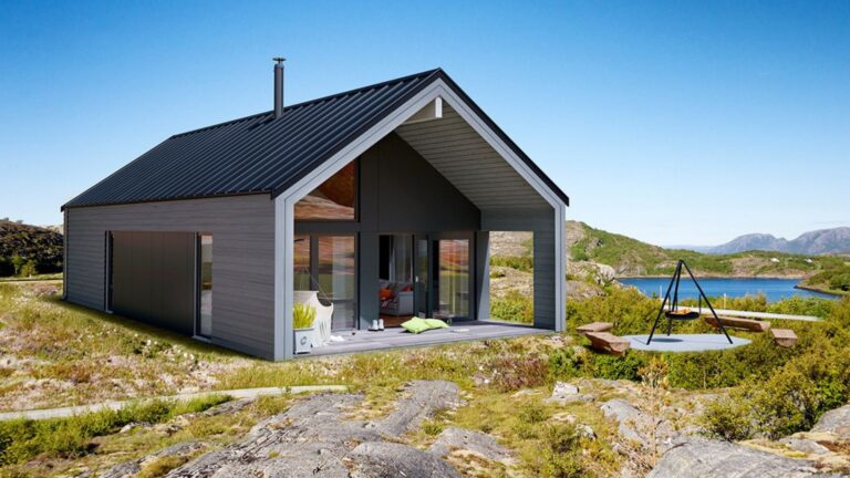 exterior of a cabin surrounded by green land and the sea