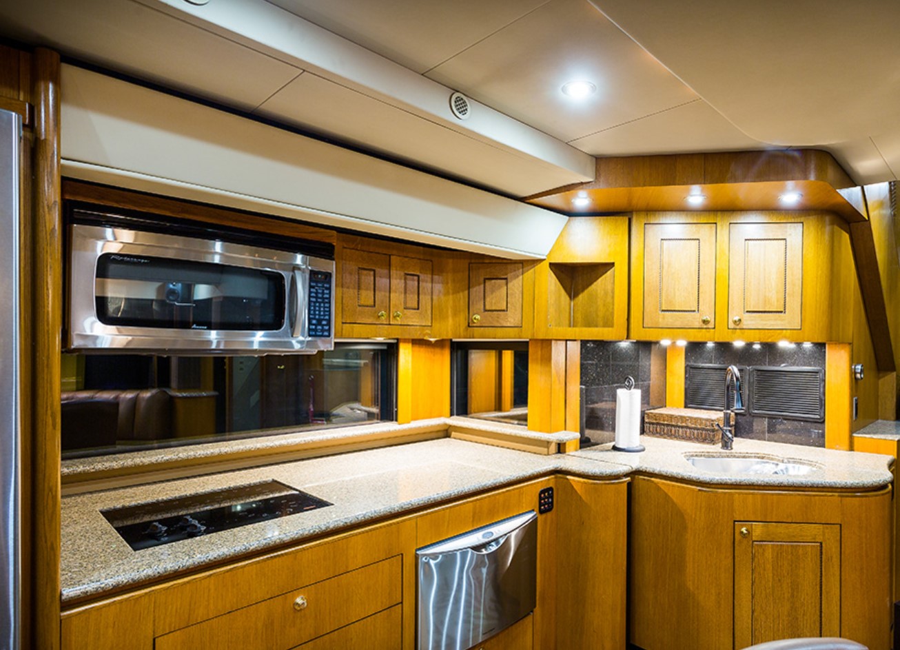 Wooden kitchen in motorhome with granite countertops