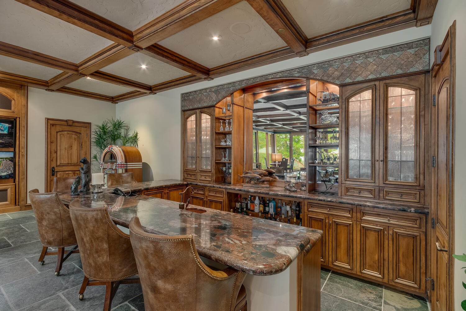 bar with a countertop inside of a cottage home