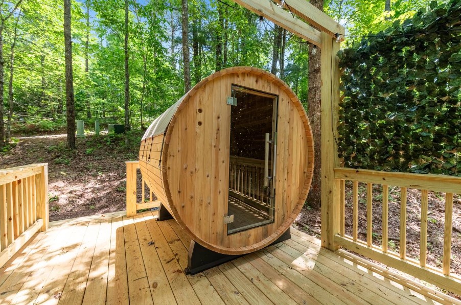 outside barrel sauna surrounded in the woods