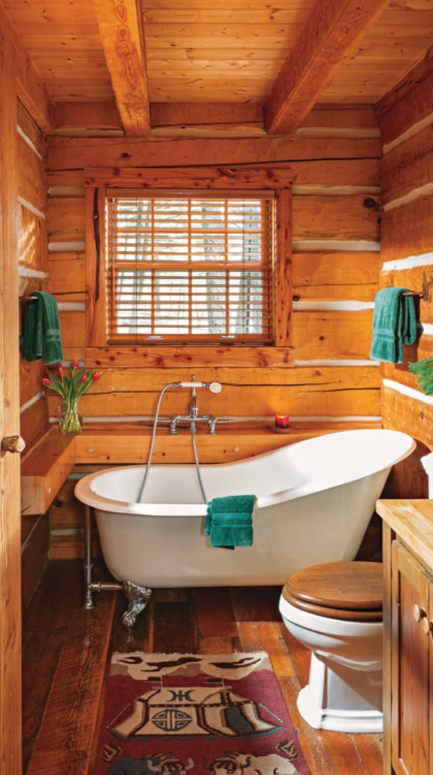 Wooden bathroom with clawfoot bathtub