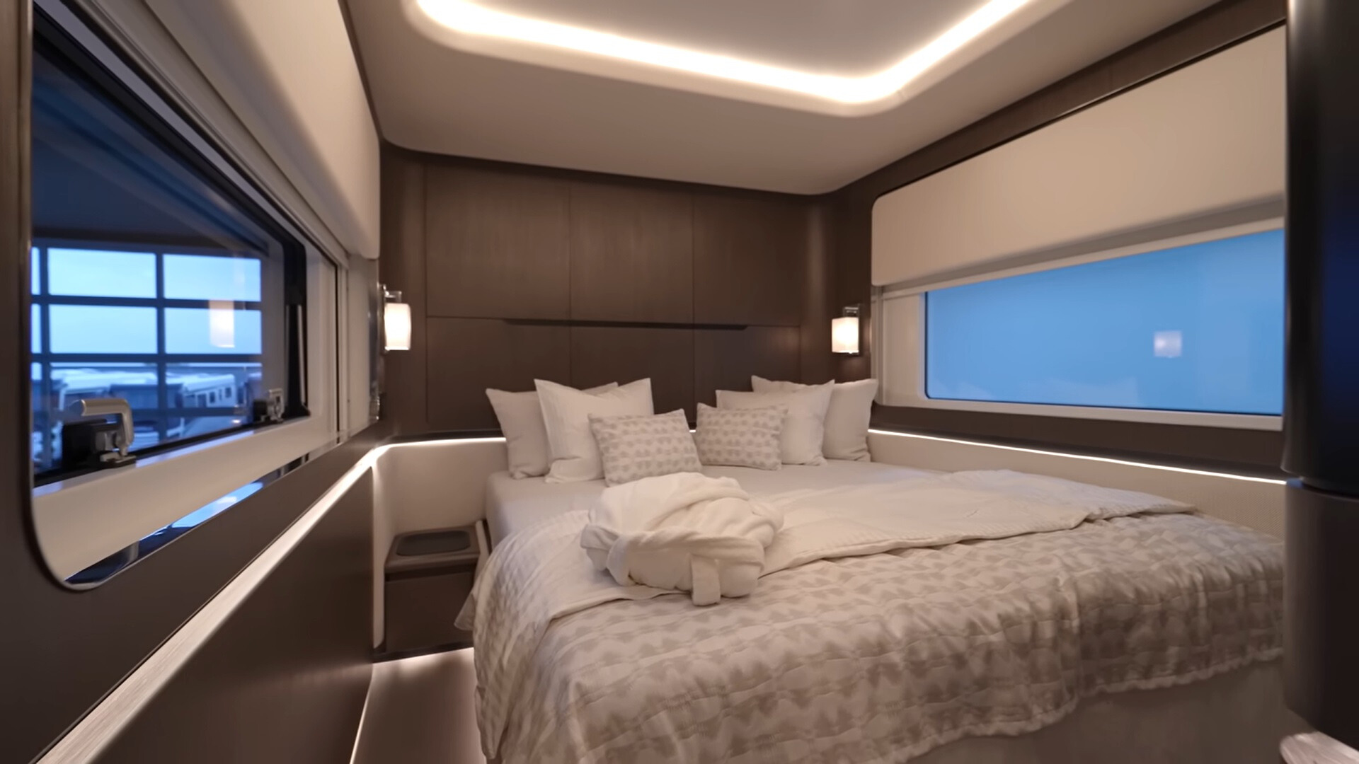 bedroom with windows on both sides and a bed in the middle