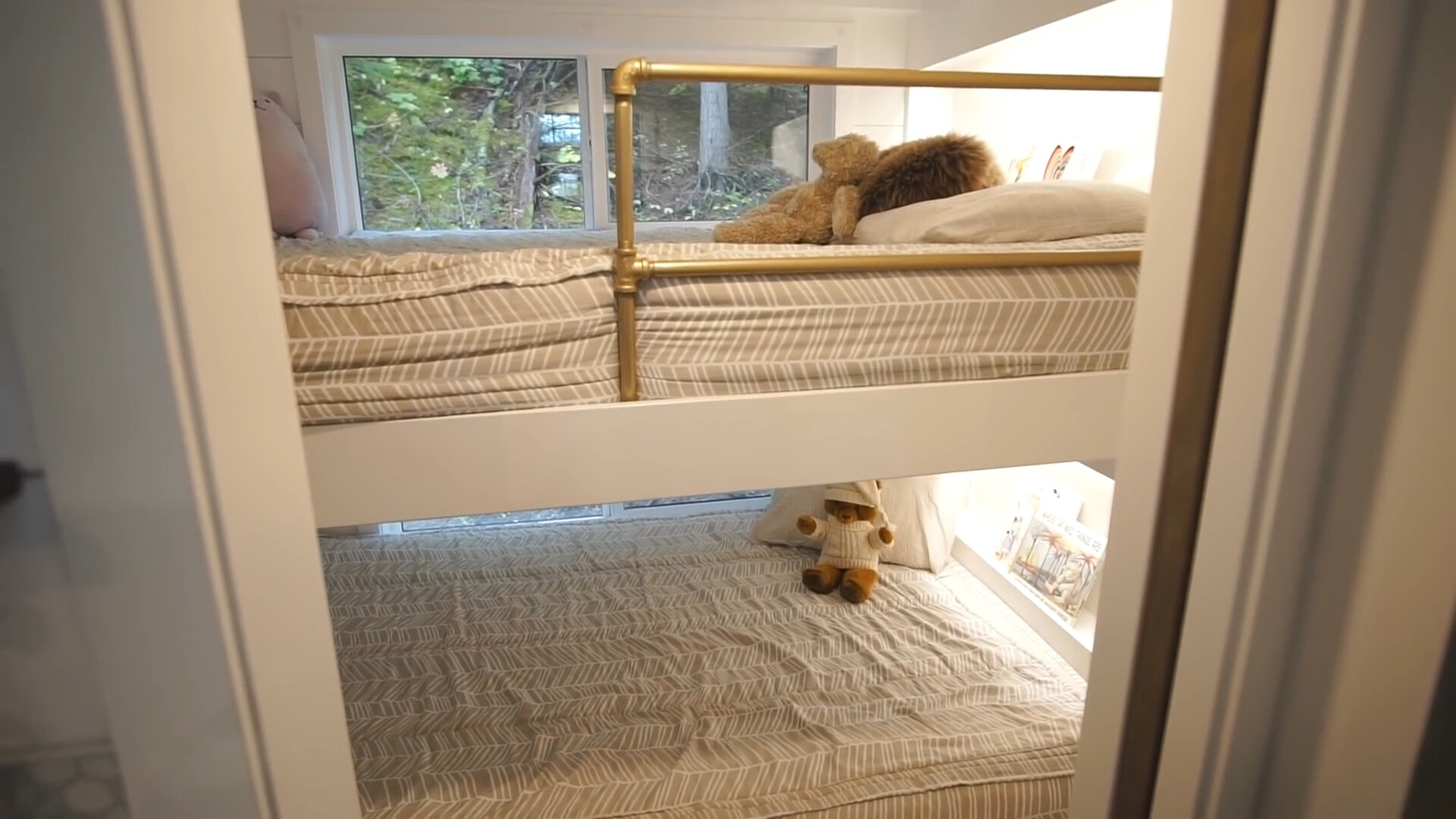 bedroom with a bunk bed and windows