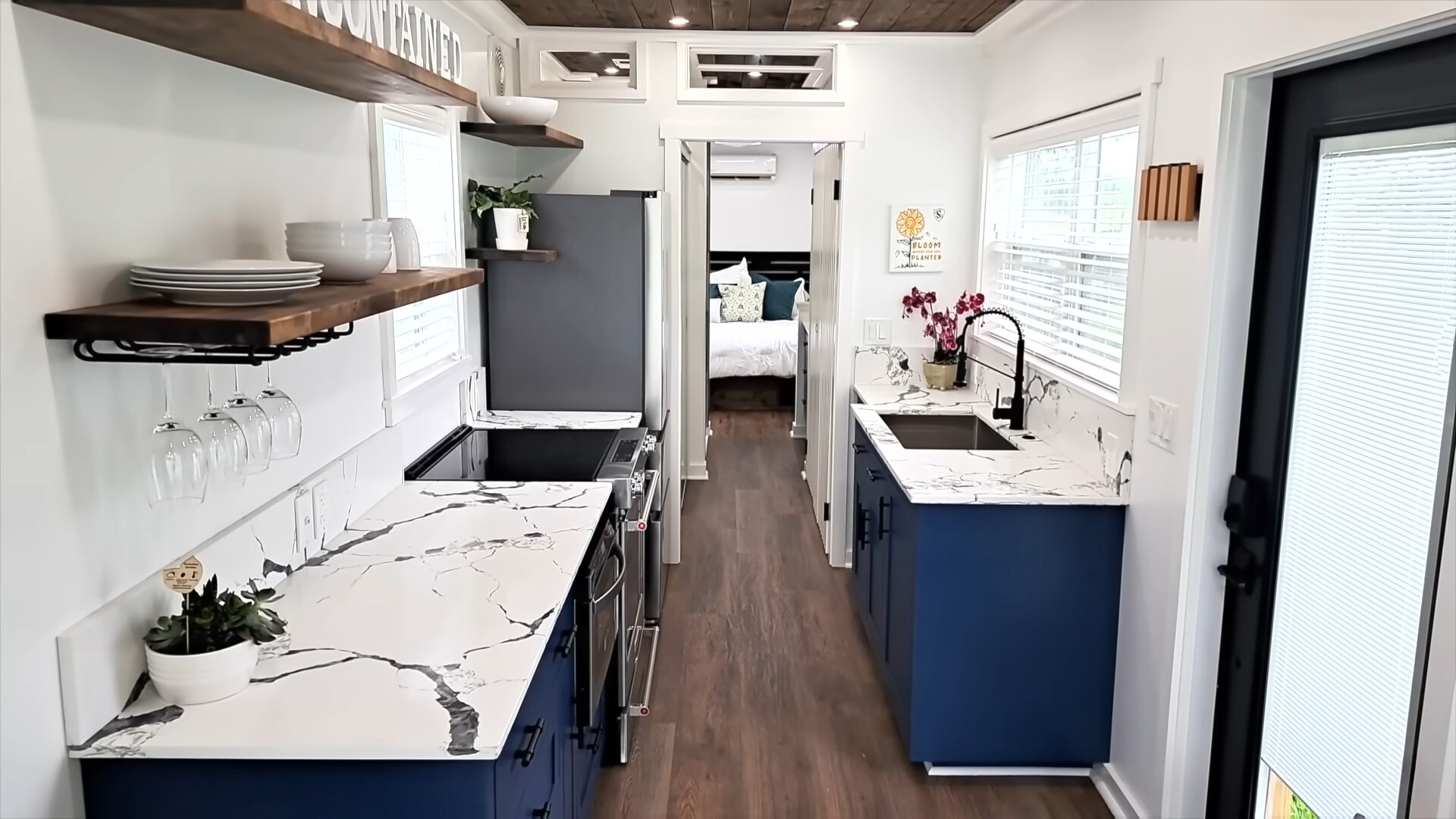 kitchen with white marble stone countertop and blue cabinets