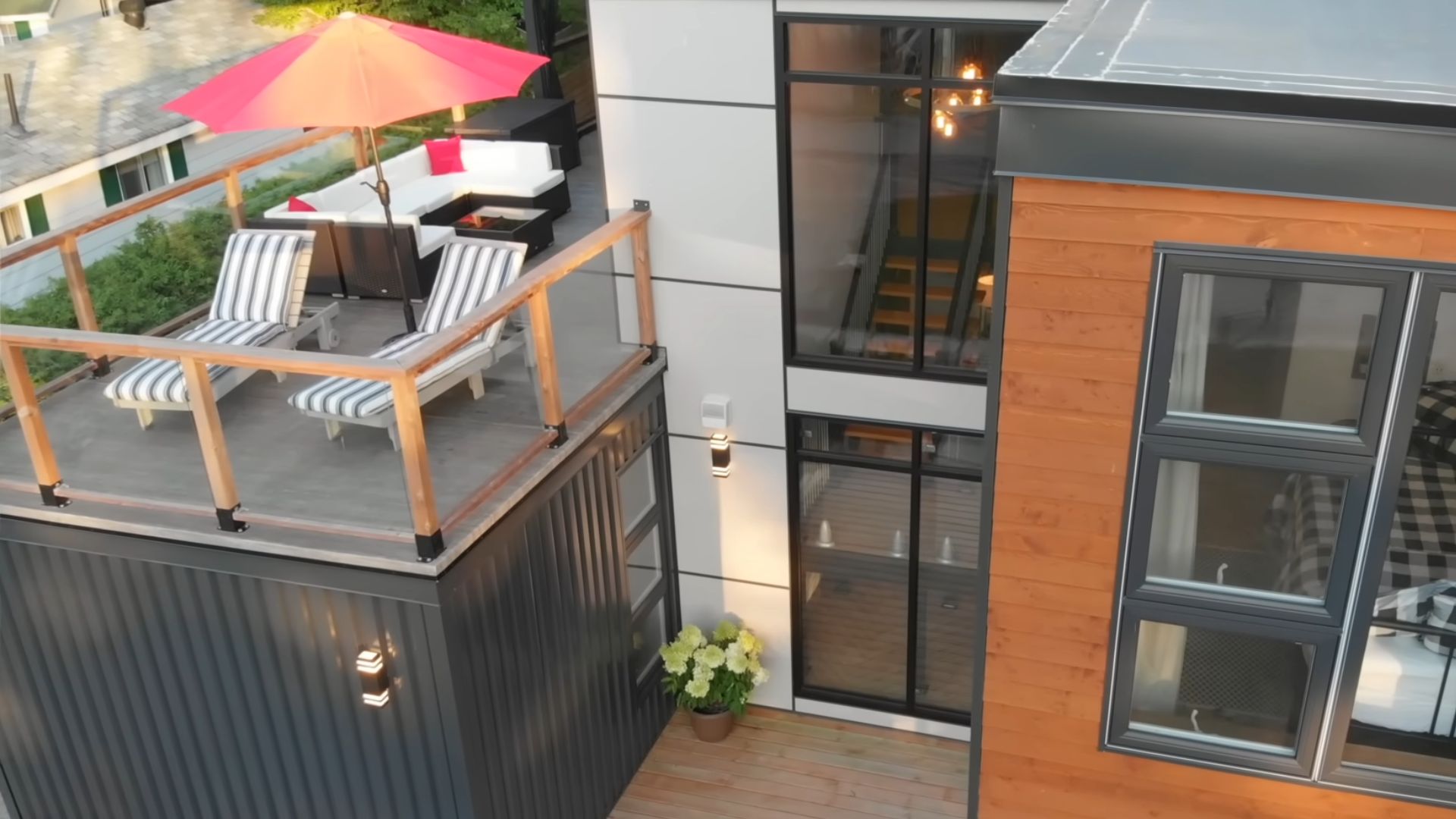 close up photo of roof top deck and two lounges for sunbathing