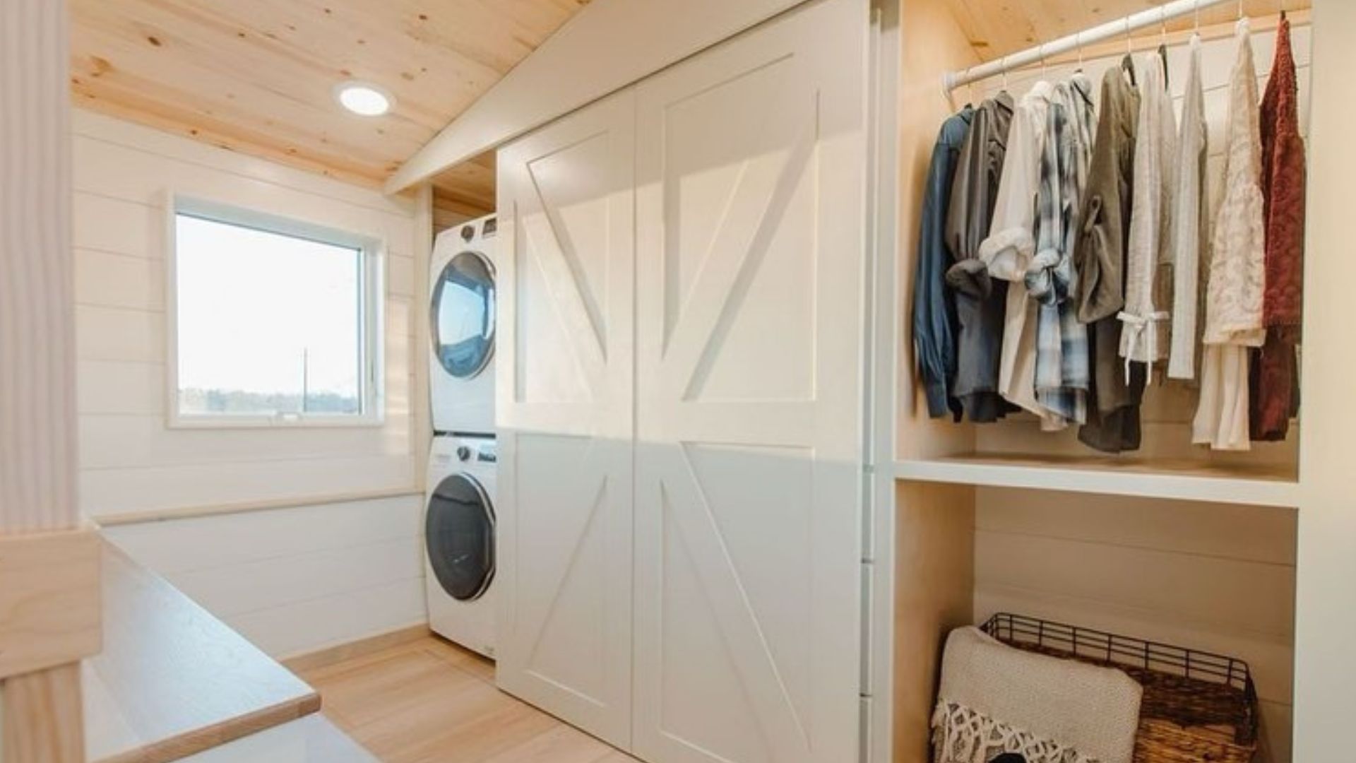 washer, dryer, and closet hidden behind soft-close barn doors