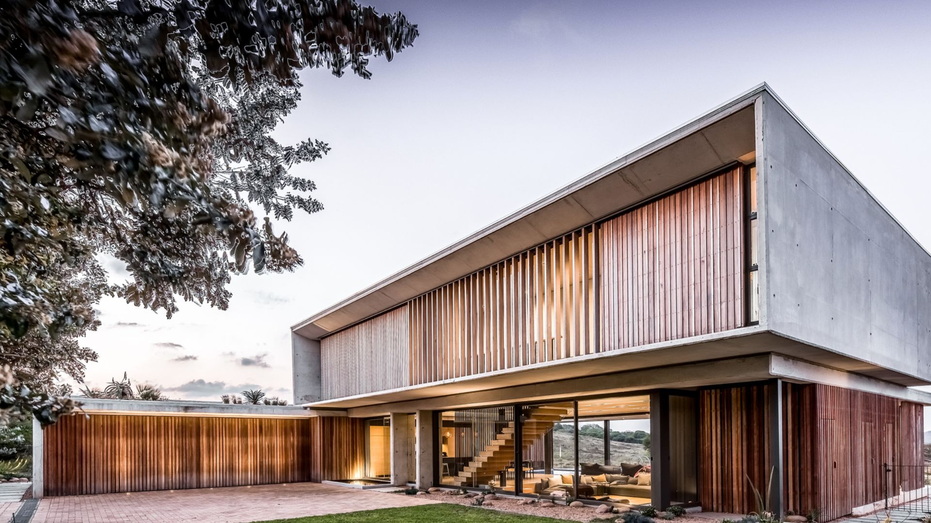 exterior of the modern concrete house with wooden screens