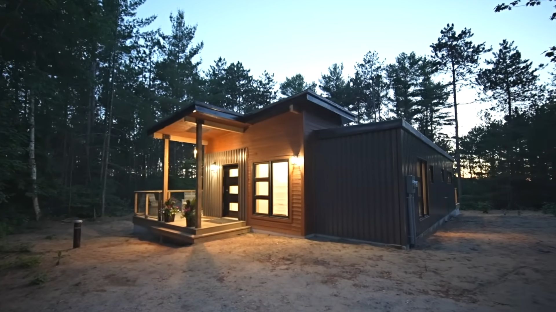 container house at night with lights on at the entrance